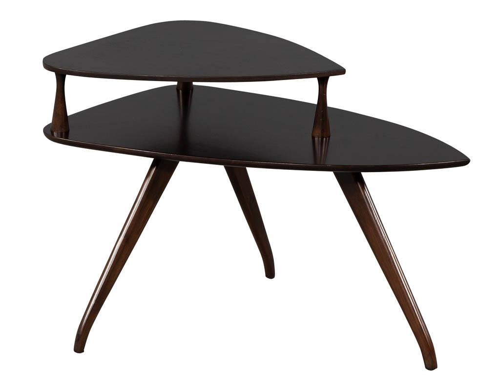 Pair of walnut Mid-Century Modern torpedo end tables. Featuring unique mid-century curved design. Glass tops are optional and original with minor wear consistent with use.

Price includes complimentary curb side delivery to the continental USA.
