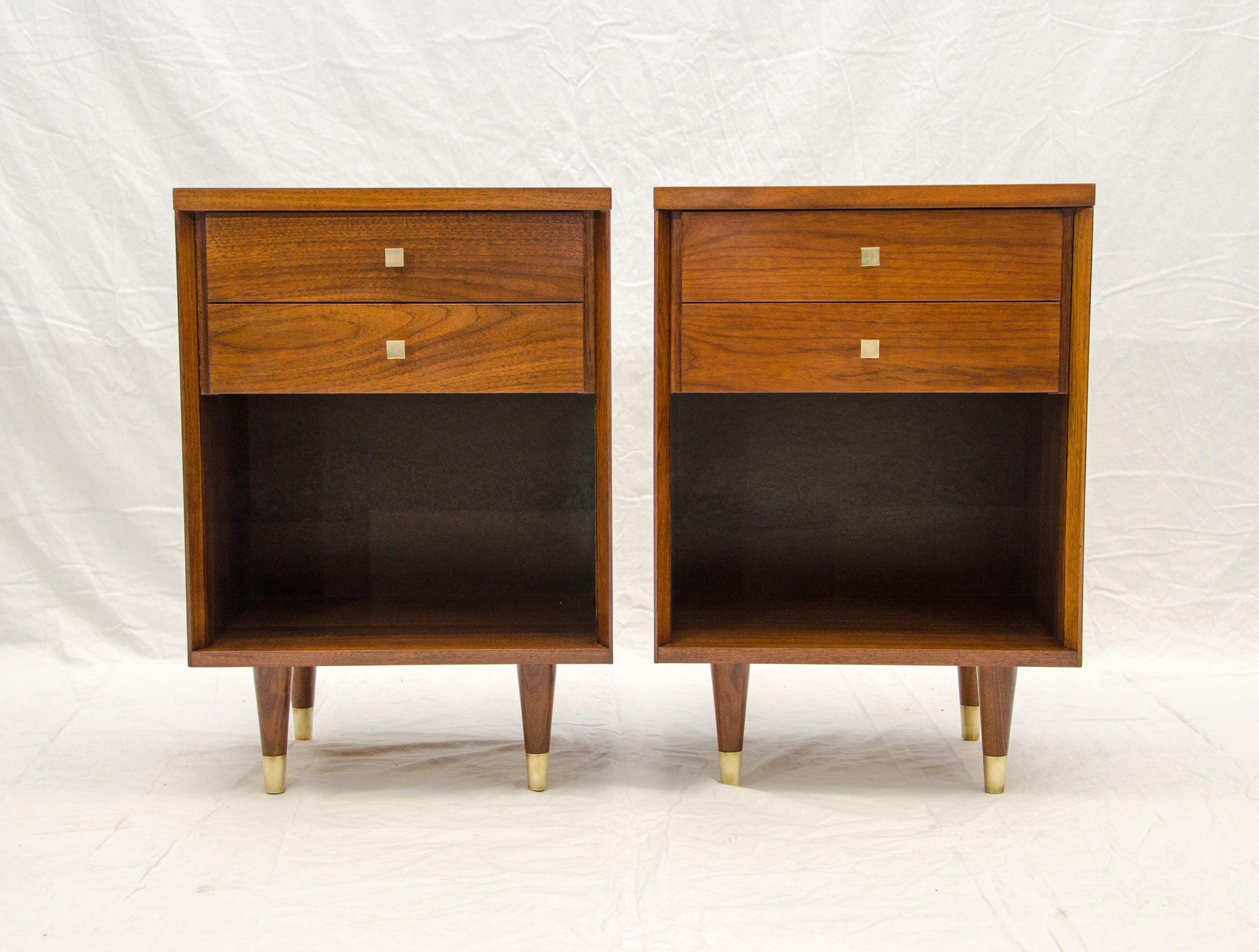 Nice pair of taller walnut nightstands with John Stuart tags. There are two small drawers (2 3/4