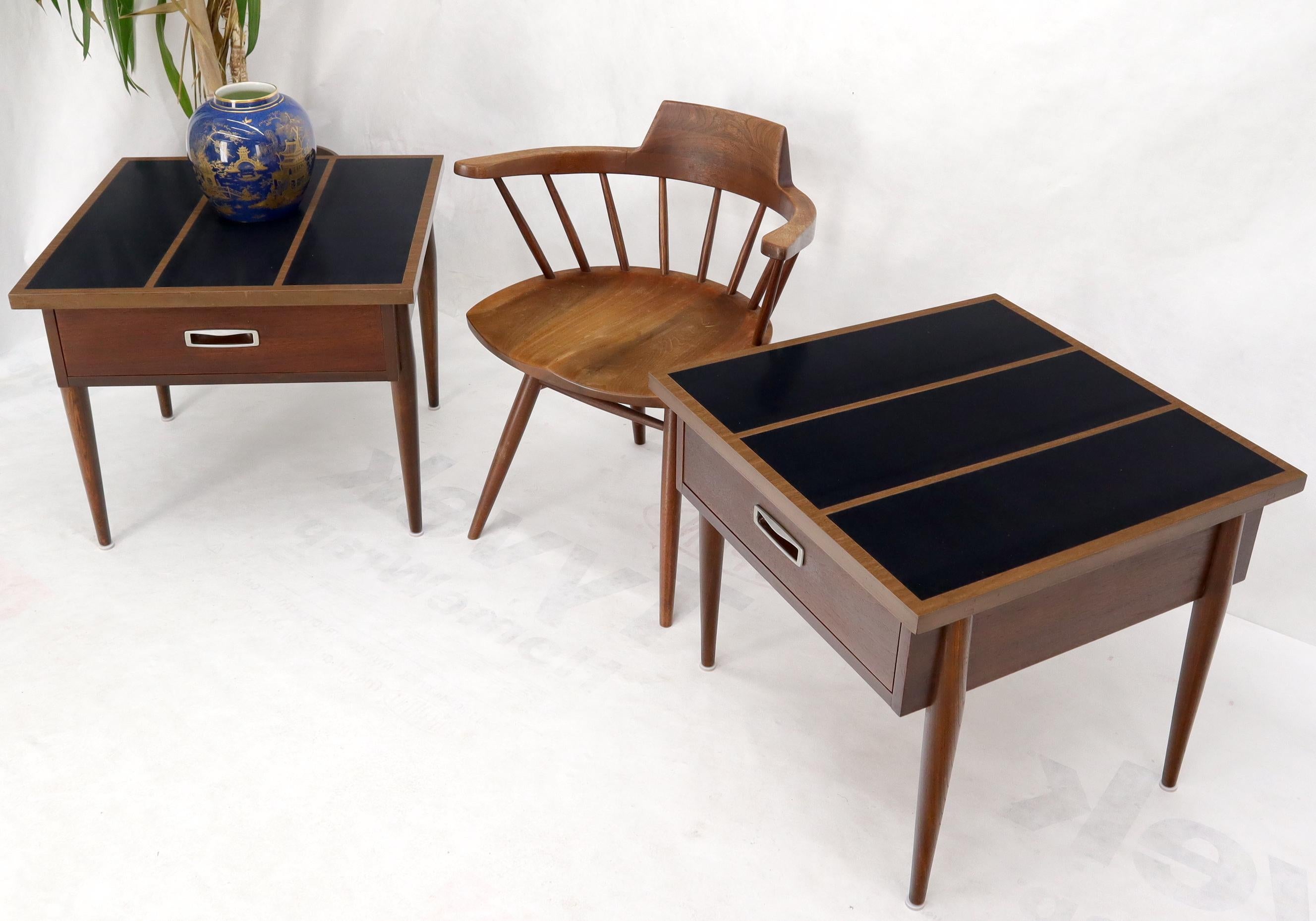 Pair of Mid-Century Modern one-drawer end side tables stands in walnut w/ laminated tops.