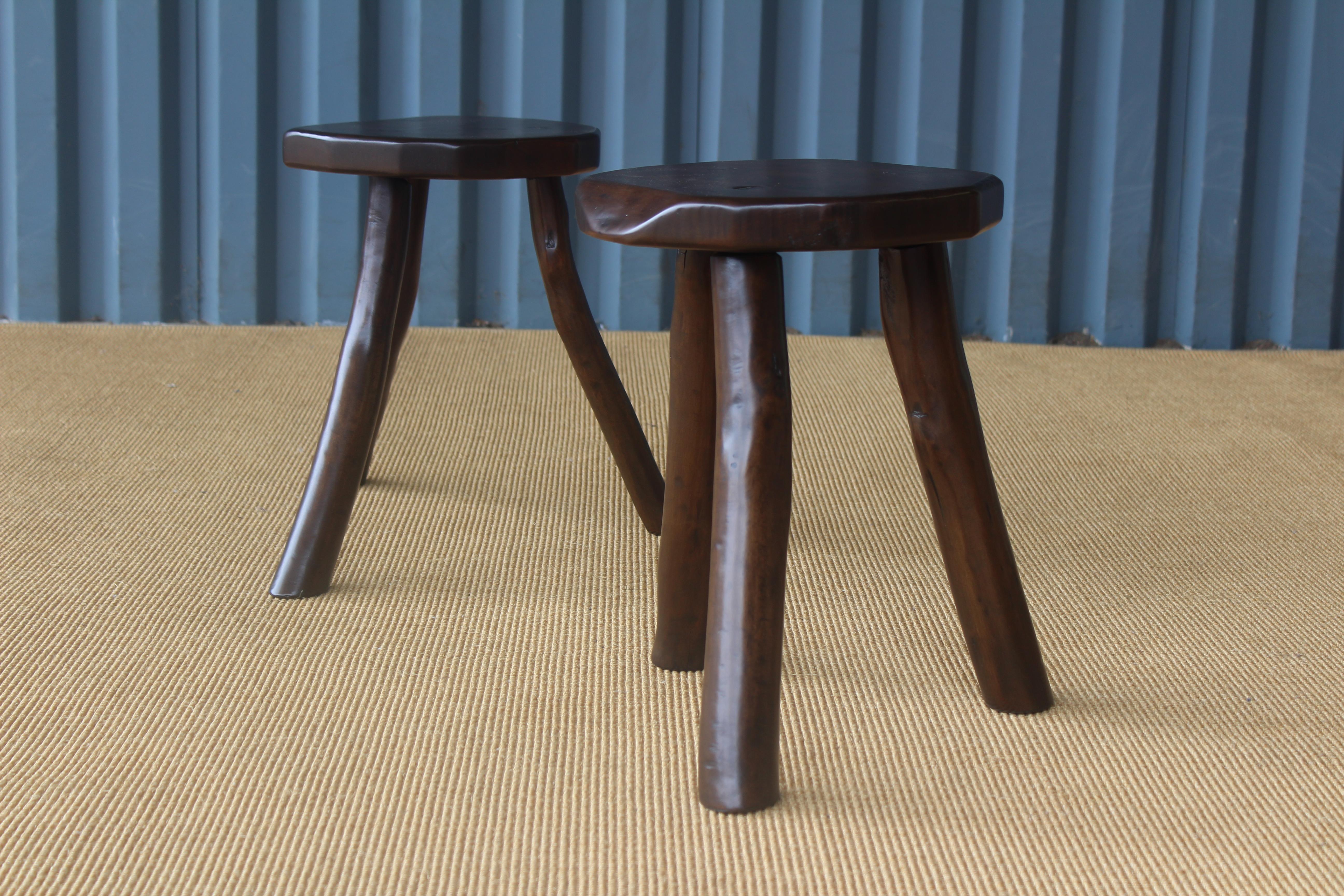 Pair of wooden raw edge stools. Sold as a pair. Recently refinish.