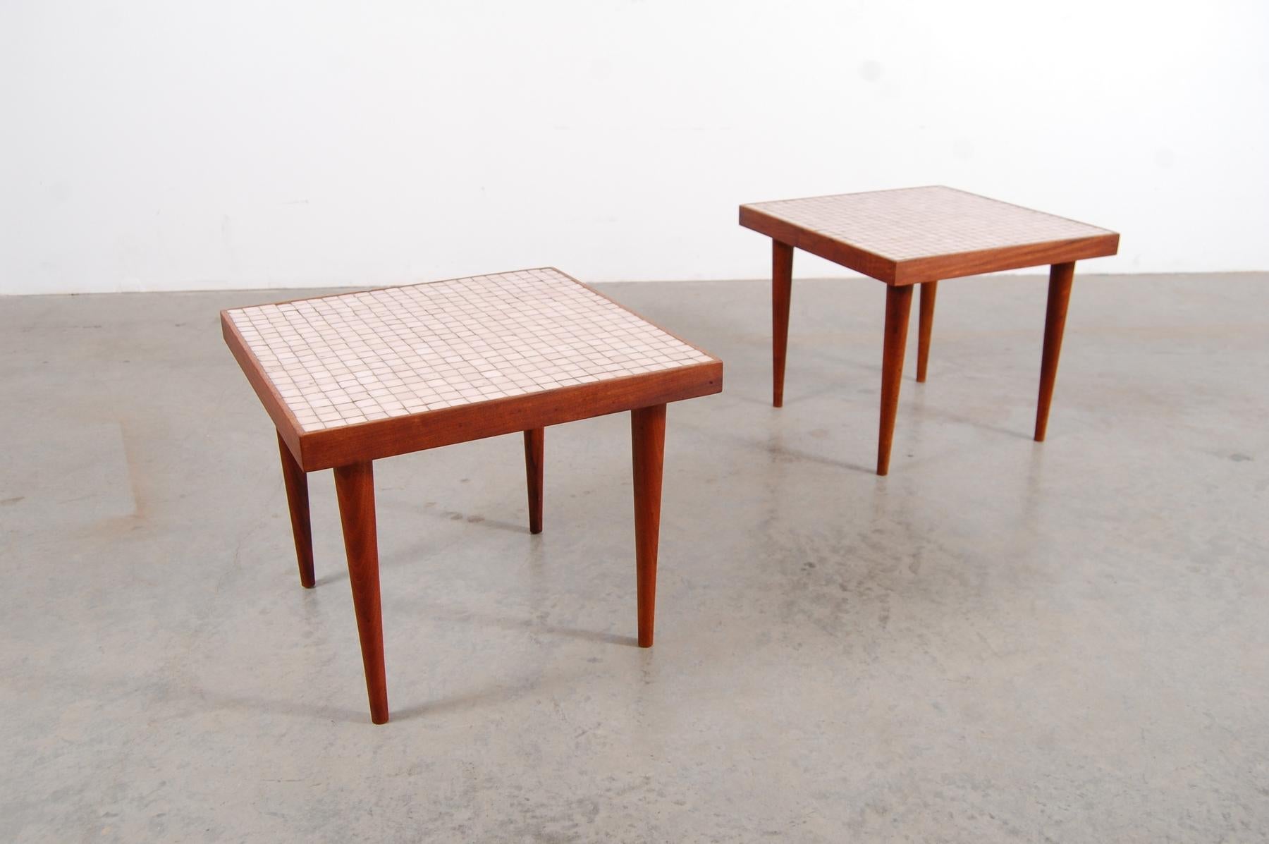 Pair of square oiled walnut tables with round tapering legs and white Murano glass tile tops, circa 1955. Each table measures 18