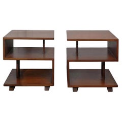 Pair of walnut three tier end tables. USA, circa 1950's