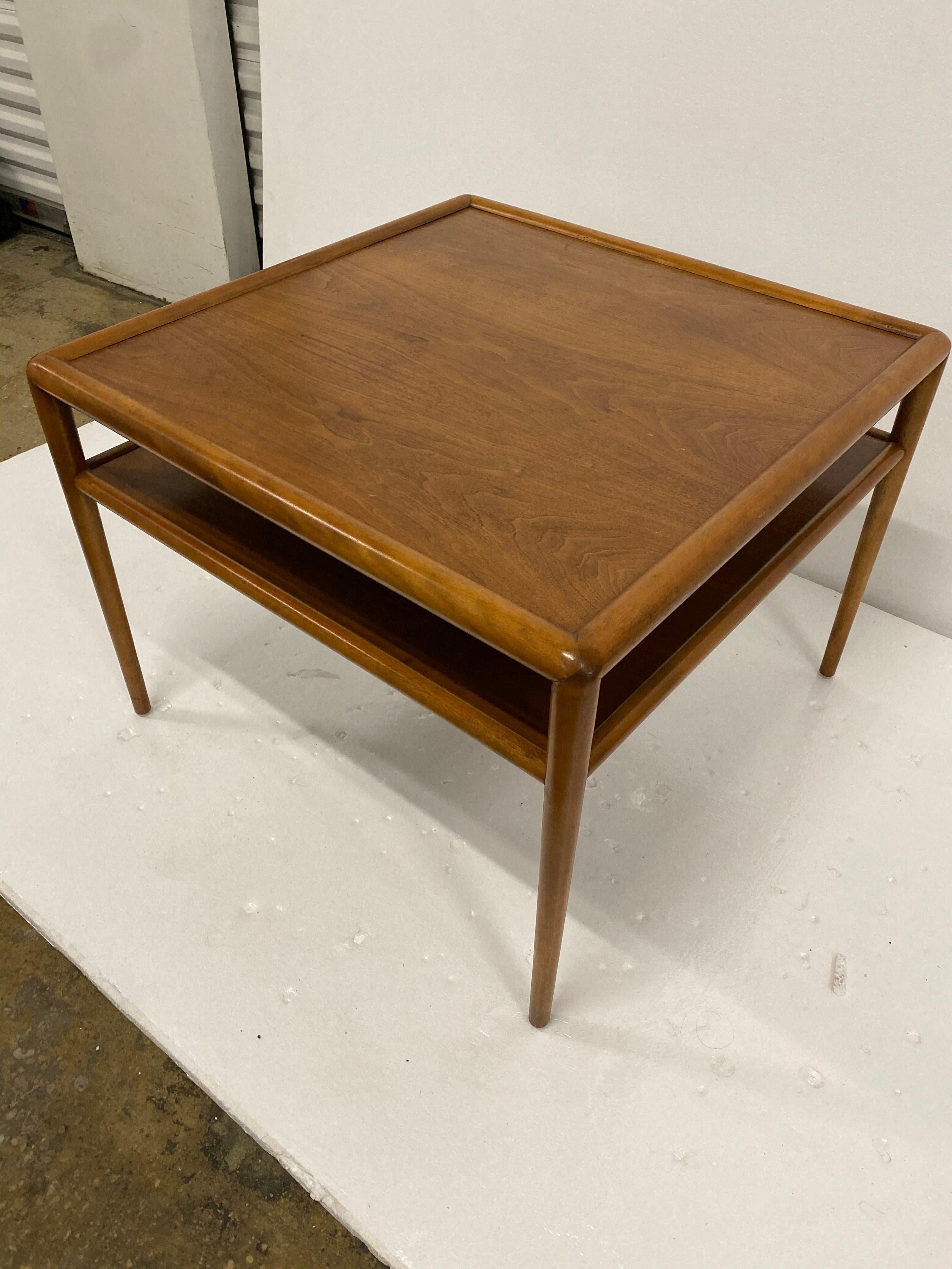 Pair of walnut modernist two tier side tables by Robsjohn Gibbins for Widdicomb 