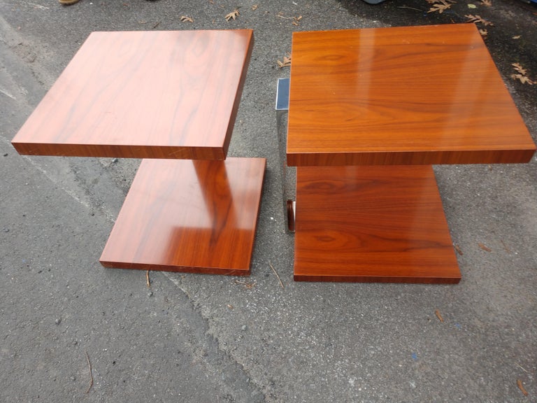 Fabulous and well constructed top quality pair of Walnut end tables with chromed steel supports. Would also work as night stands. Perfect blend of walnut and chrome. Large surface area for lighting and decorations. In excellent vintage condition