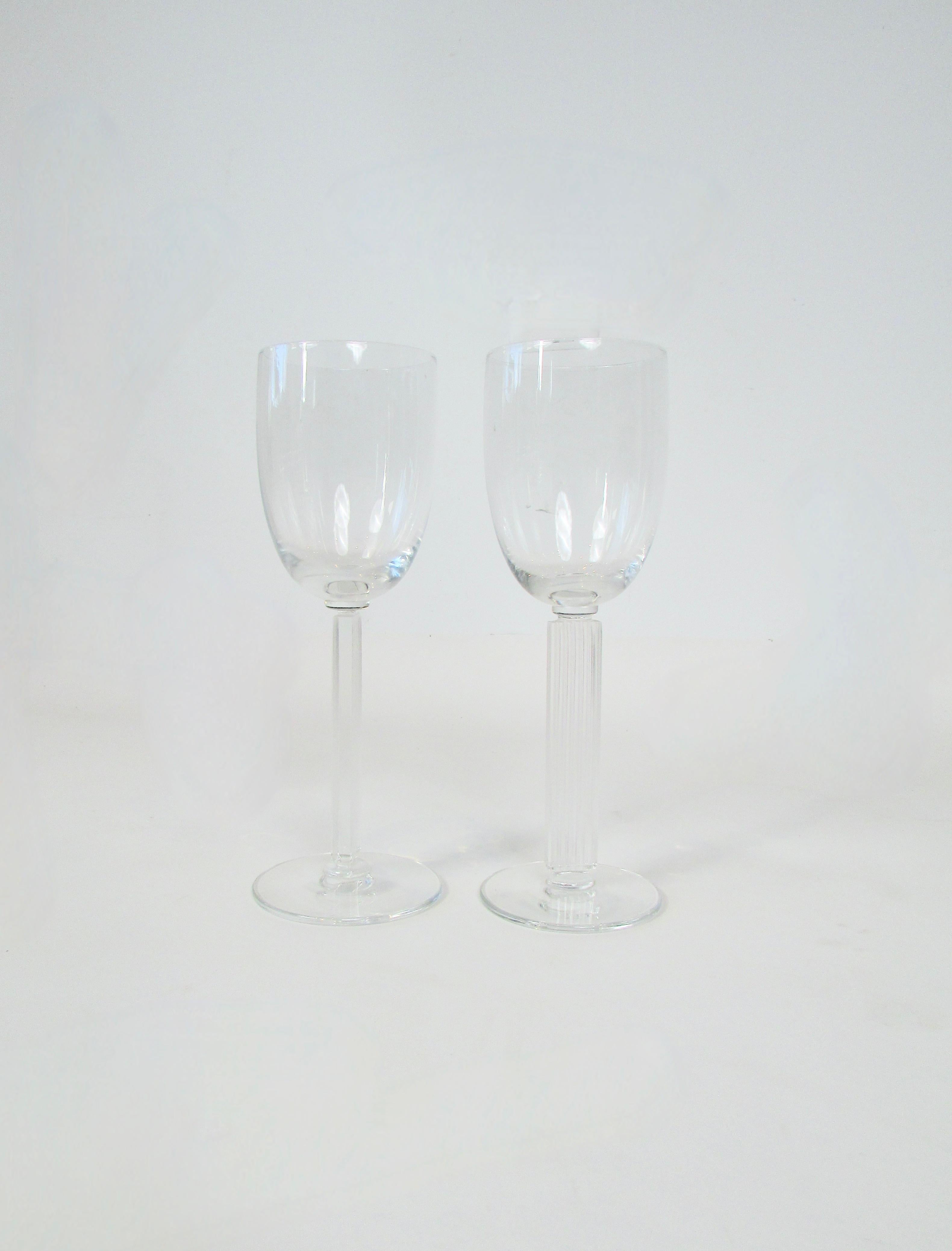 Pair of Embassy pattern champagne coupes or martini glasses designed by Walter Dorwin Teague and Edwin W. Fuerst for the Libbey glass company in 1939. Styled during the Art Deco machine age and somewhat scarce today . Embassy pattern stemware can be