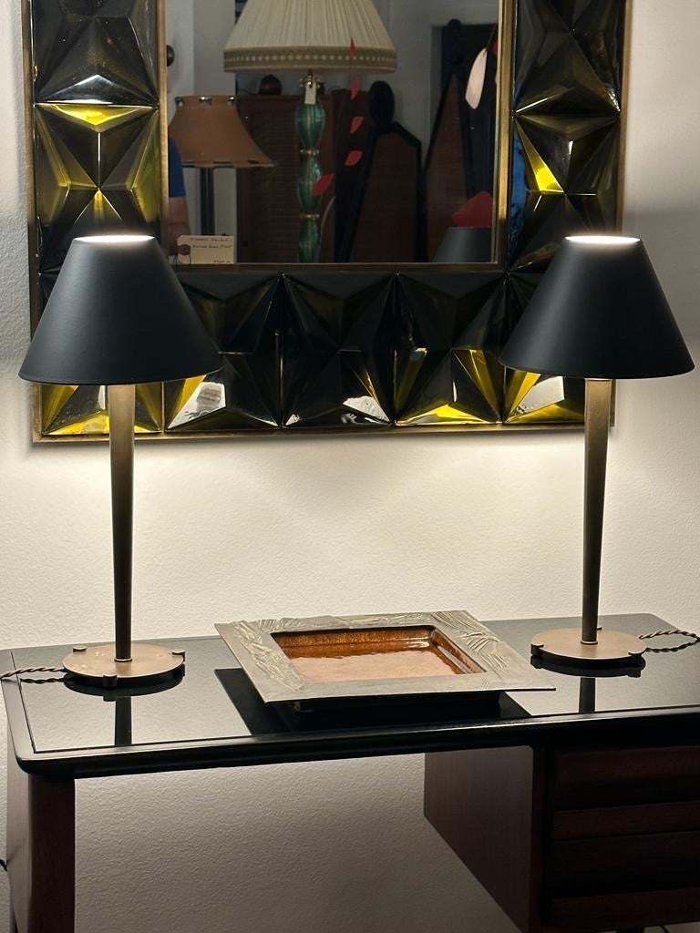 Early Walter Von Nessen design table lamps, stamped to bottom.  Medium sized dark bronze patinated original finish with new brown silk cable.  Original Bakelite sockets and original plugs refurbished.  Some patina to base on one of the lamps, see