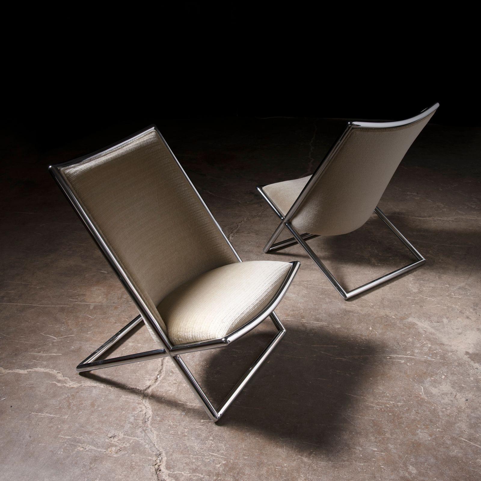 An exceptional pair of mid-century modern Scissor lounge chairs designed by Ward Bennett for Brickel Associates, circa 1960s. These iconic chairs feature striking chrome-plated steel frames with their original taupe mohair upholstery, which remains