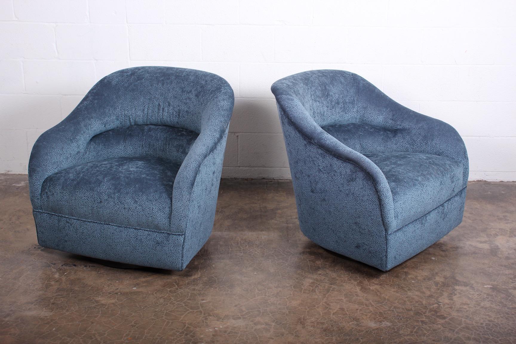 A pair of swivel chairs designed by Ward Bennett for Brickell.