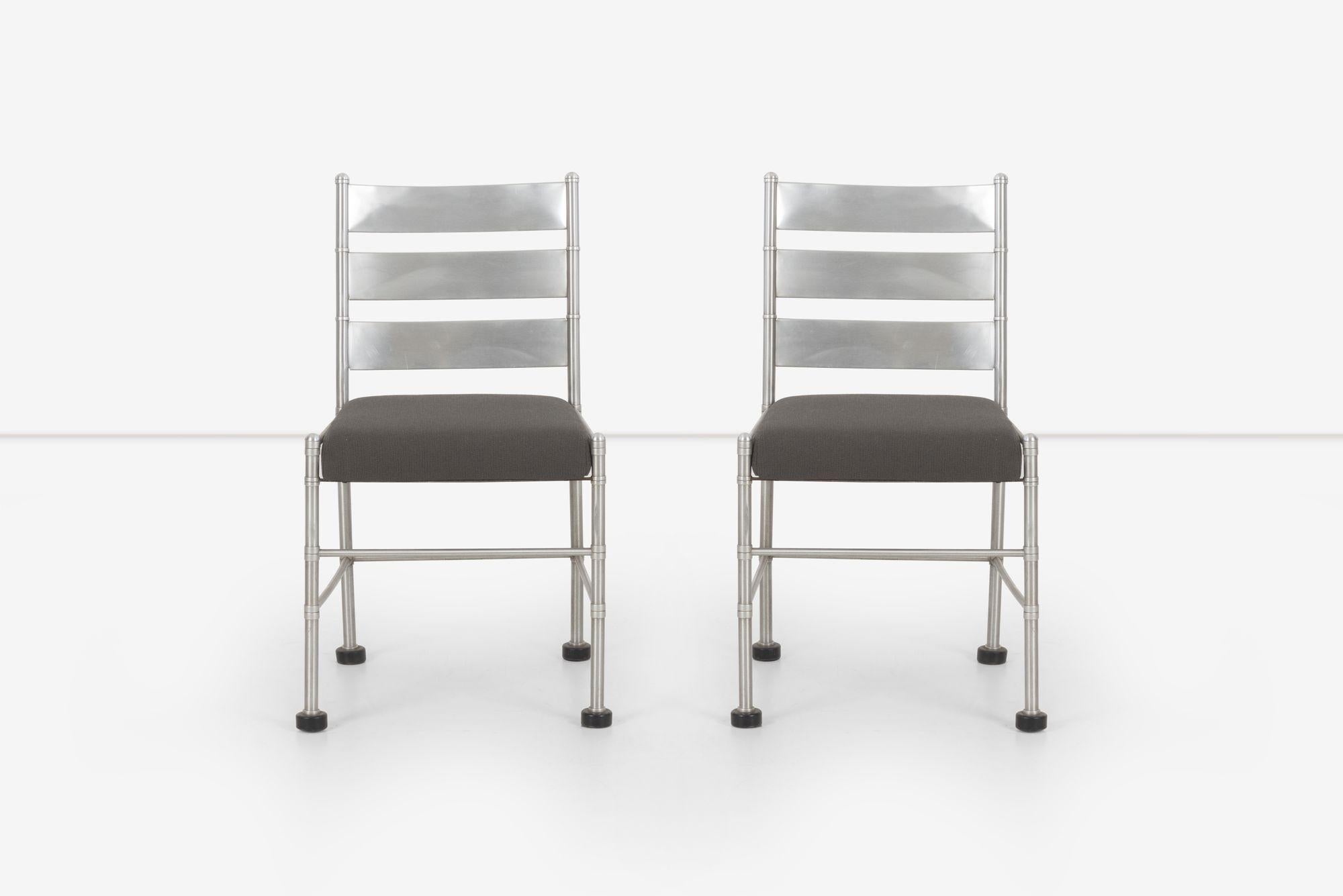Pair of Warren McArthur pull-up chairs, 1930's Aluminum tubular frame with back-slats.
Manufactured in Rome, New York Decal underside.
We reupholstered with new Iron Cloth, a polyester wool-like fabric.
 
Measure: Seat height: 19