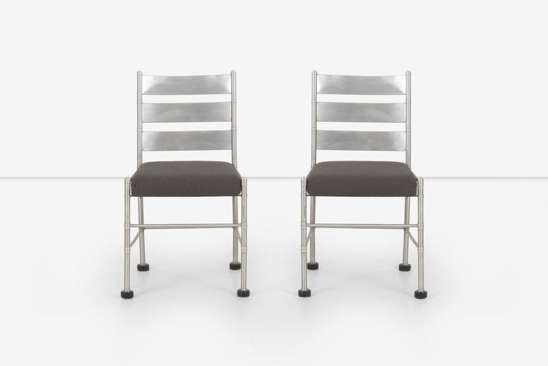 Pair of Warren McArthur pull-up chairs, 1930's Aluminum tubular frame with back-slats.
Manufactured in Rome, New York Decal underside.
We reupholstered with new Iron Cloth, a polyester wool-like fabric.
 
Measure: Seat height: 19