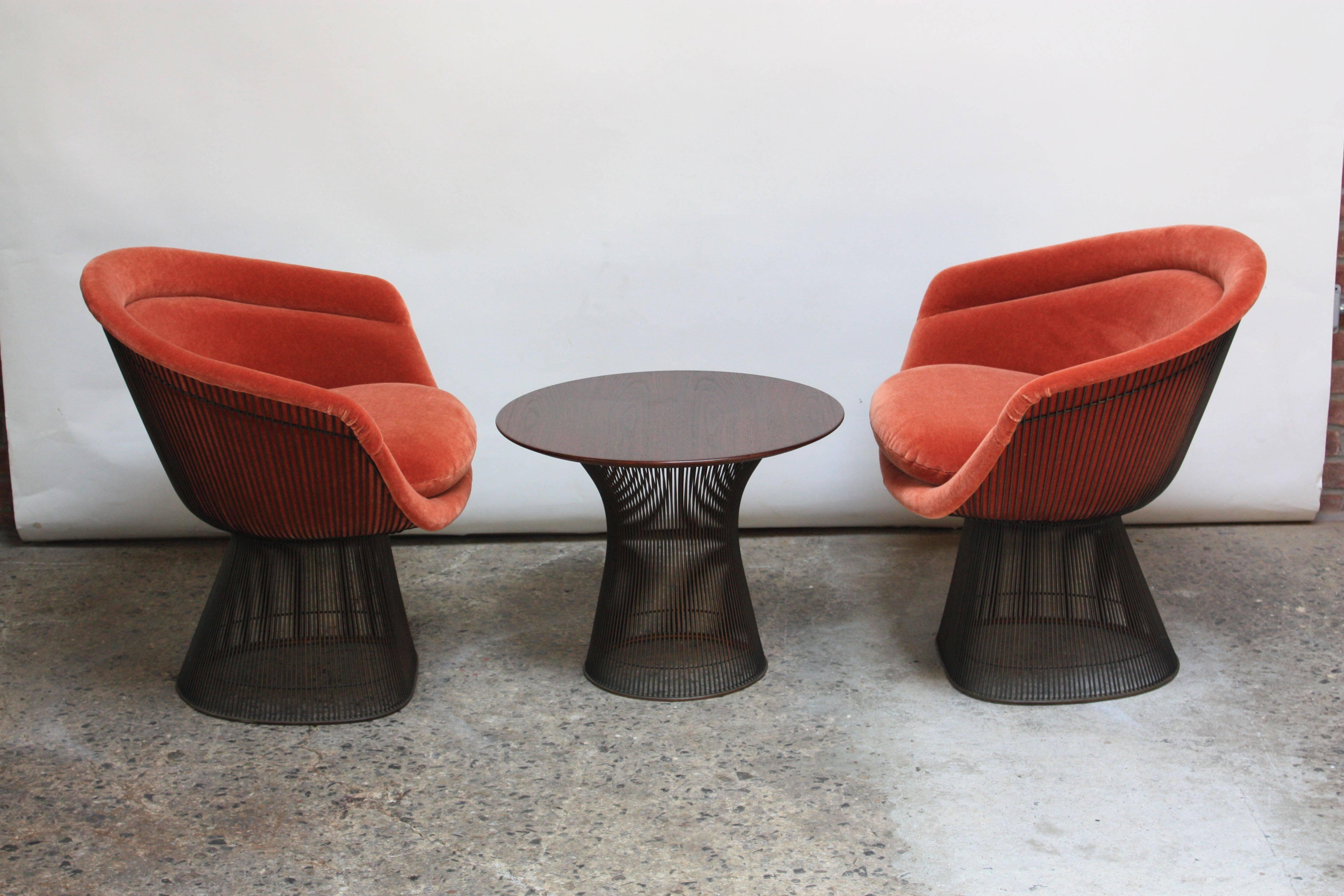 Suite of early (circa 1966) Warren Platner for Knoll Associates bronze-framed pieces: two wire lounge chairs redone in blood orange mohair and one wire-framed, walnut-top occasional table. Steel-rod construction with bronze-plate (a finish no longer