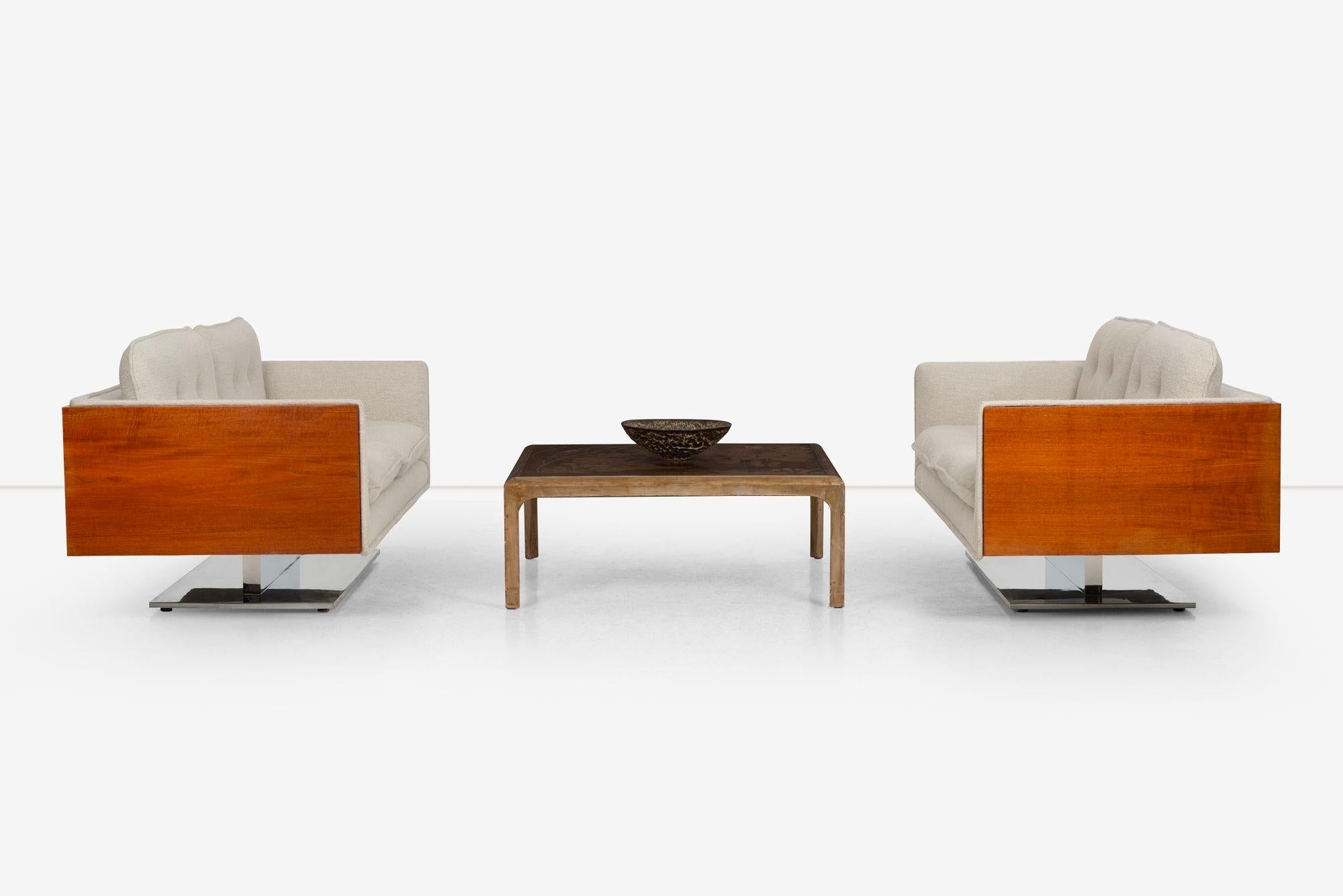 Pair of Warren Platner Sofas in Teakwood for Lehigh Leopold, 1970
This pair of Warren Platner sofas features a beautifully crafted oiled teakwood frame complemented by a polished aluminum base. The sofas have been newly reupholstered in Holly Hunt
