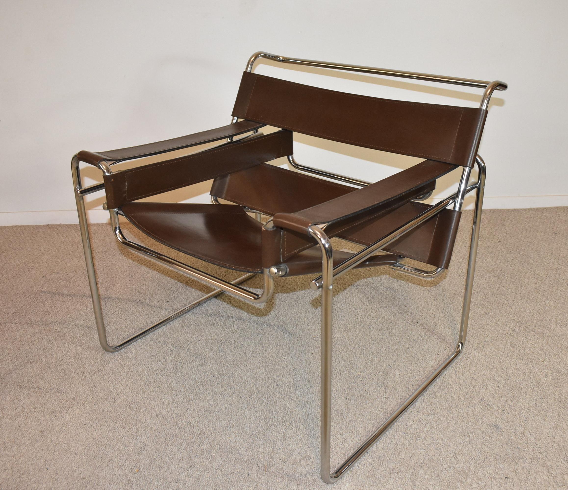 Pair of Wassily sling armchairs by Knoll in brown leather and chrome. The Wassily Chair, also known as the Model B3 chair, was designed by Marcel Breuer in 1925–1926 while he was the head of the cabinet-making workshop at the Bauhaus, in Dessau,