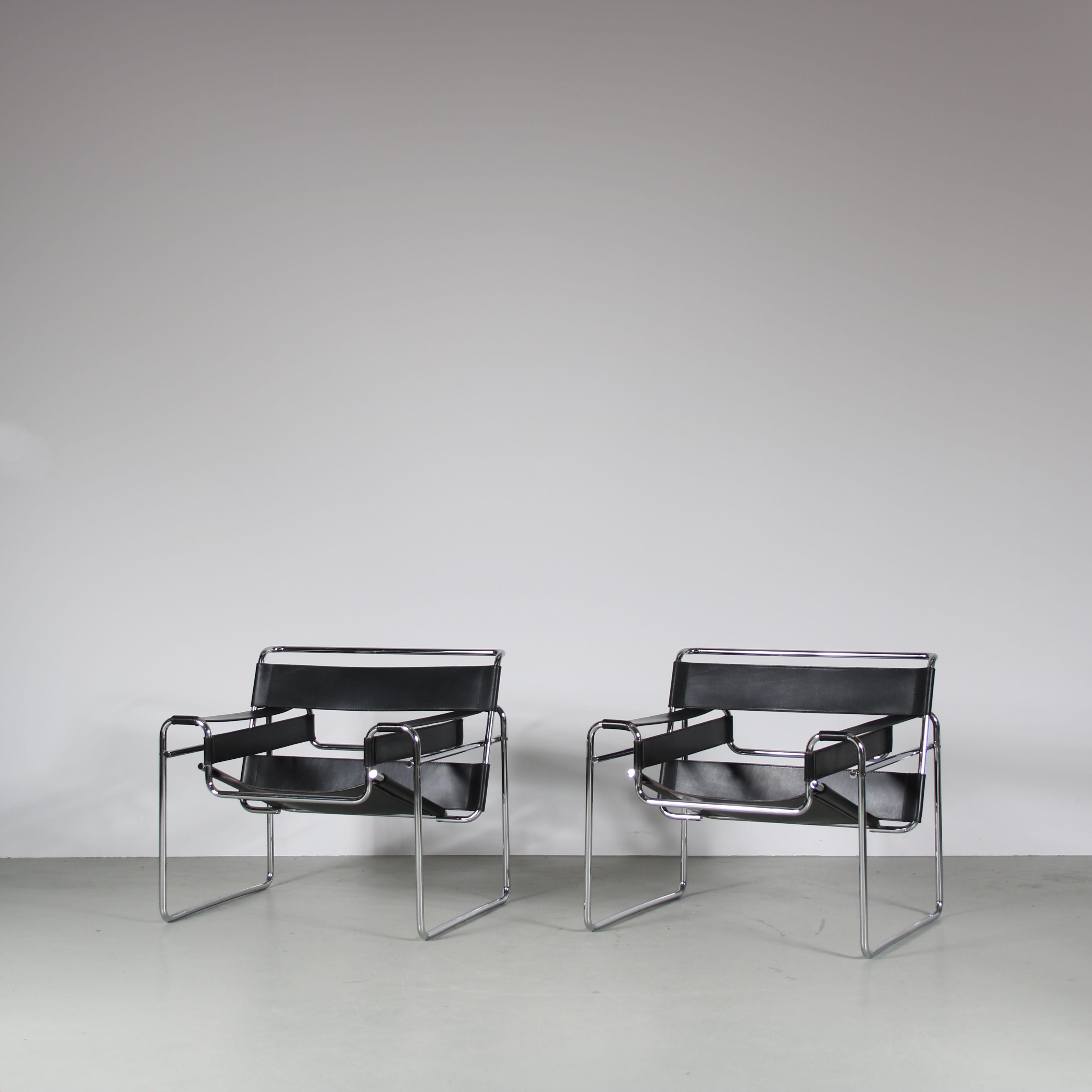 This elegant pair of “Wassily” chairs is a stunning representation of Marcel Breuer’s iconic modernist design. Originally designed in 1925-26, this particular pair was produced by Gavina in Italy during the 1960s. The chairs feature a sleek,