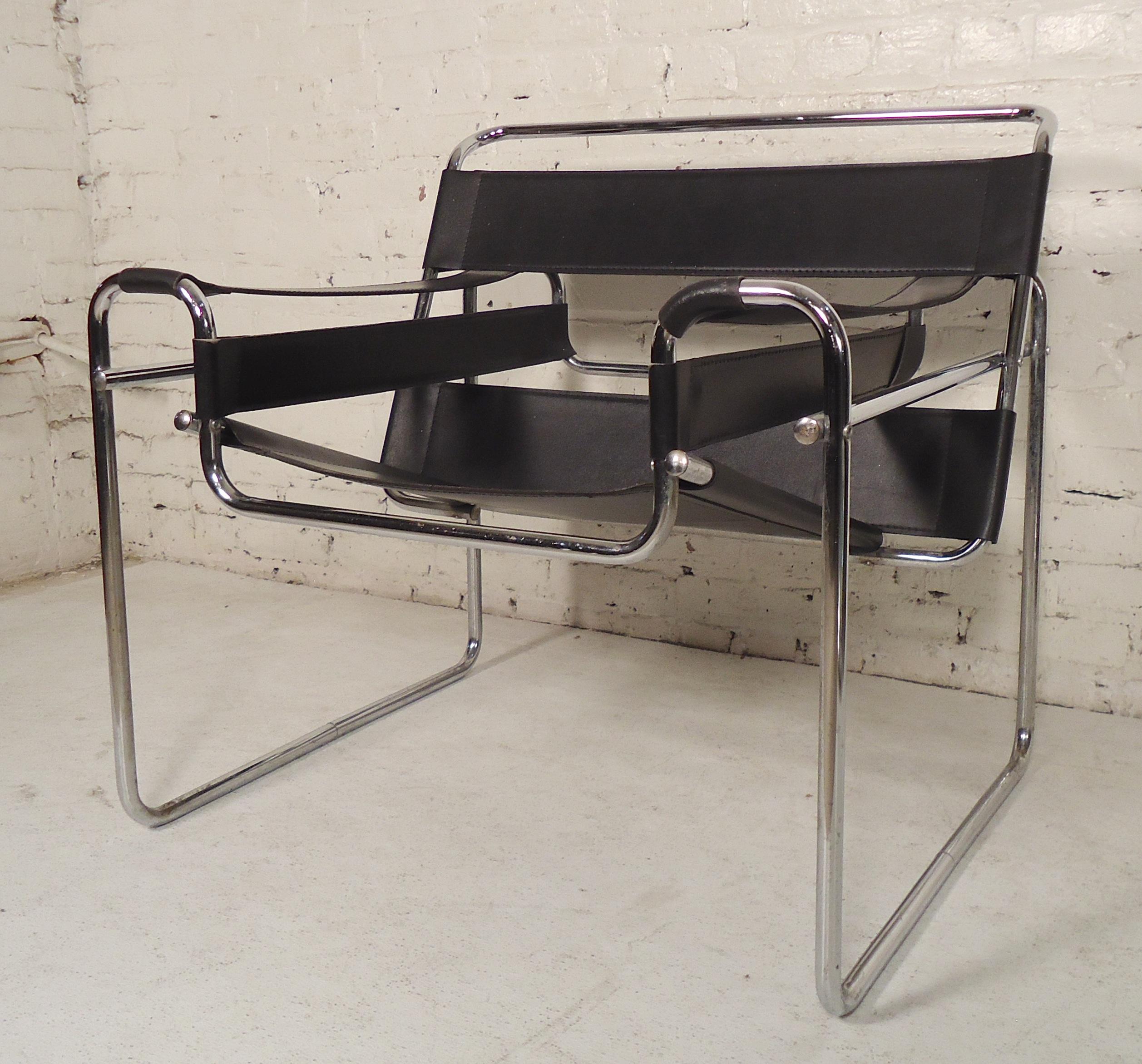 Mid-Century Modern style chairs with polished tubular frame and iconic black straps for the seat, back, and arms.

(Please confirm item location - NY or NJ - with dealer).
 