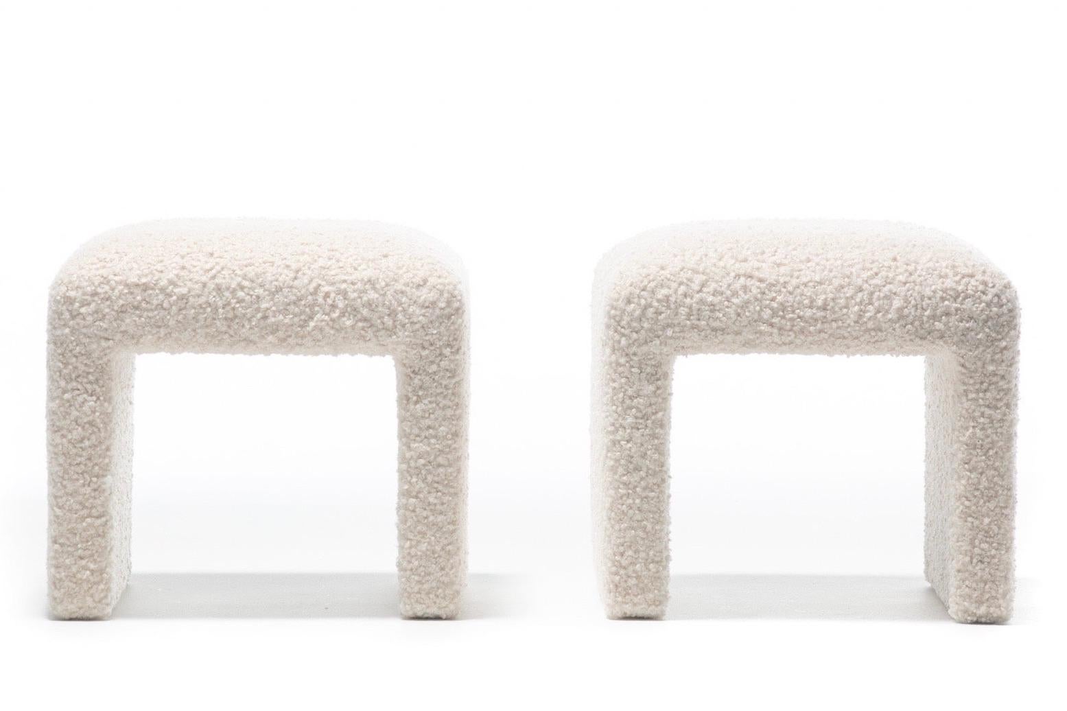 Sculptural and modern 1970s Directional waterfall benches professionally reupholstered in soft ivory bouclé fabric and photographed with a pair of Vladimir Kagan Nautilus swivel chairs - also by Directional - and a Charles Hollis Jones faux bamboo