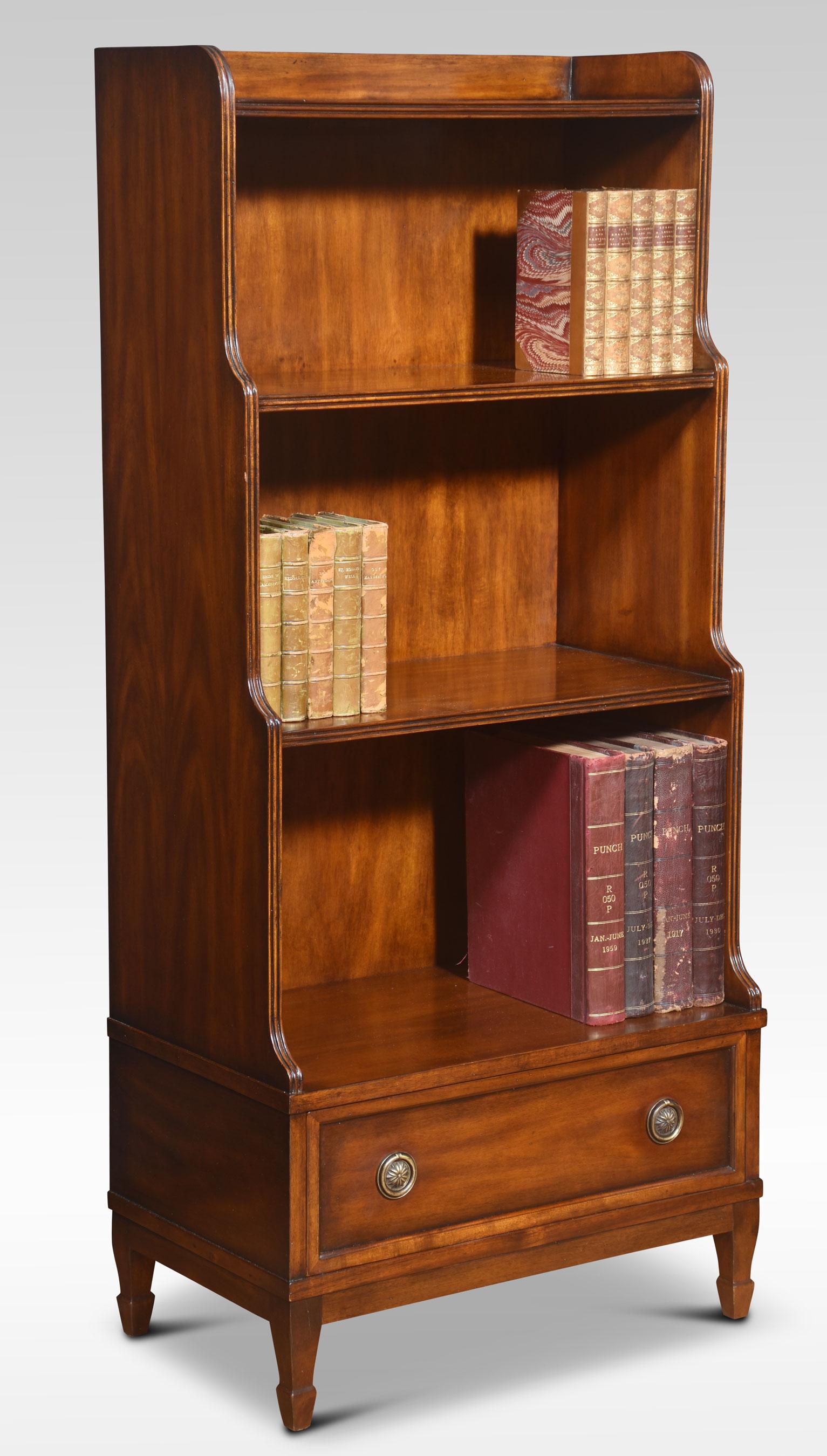 Pair of waterfall bookcases, having three graduated shelves above long drawer with brass knob handles. The base is fitted with one long draw and brass-turned knob handles. All raised up on tapering legs terminating in spade feet.
Dimensions
Height