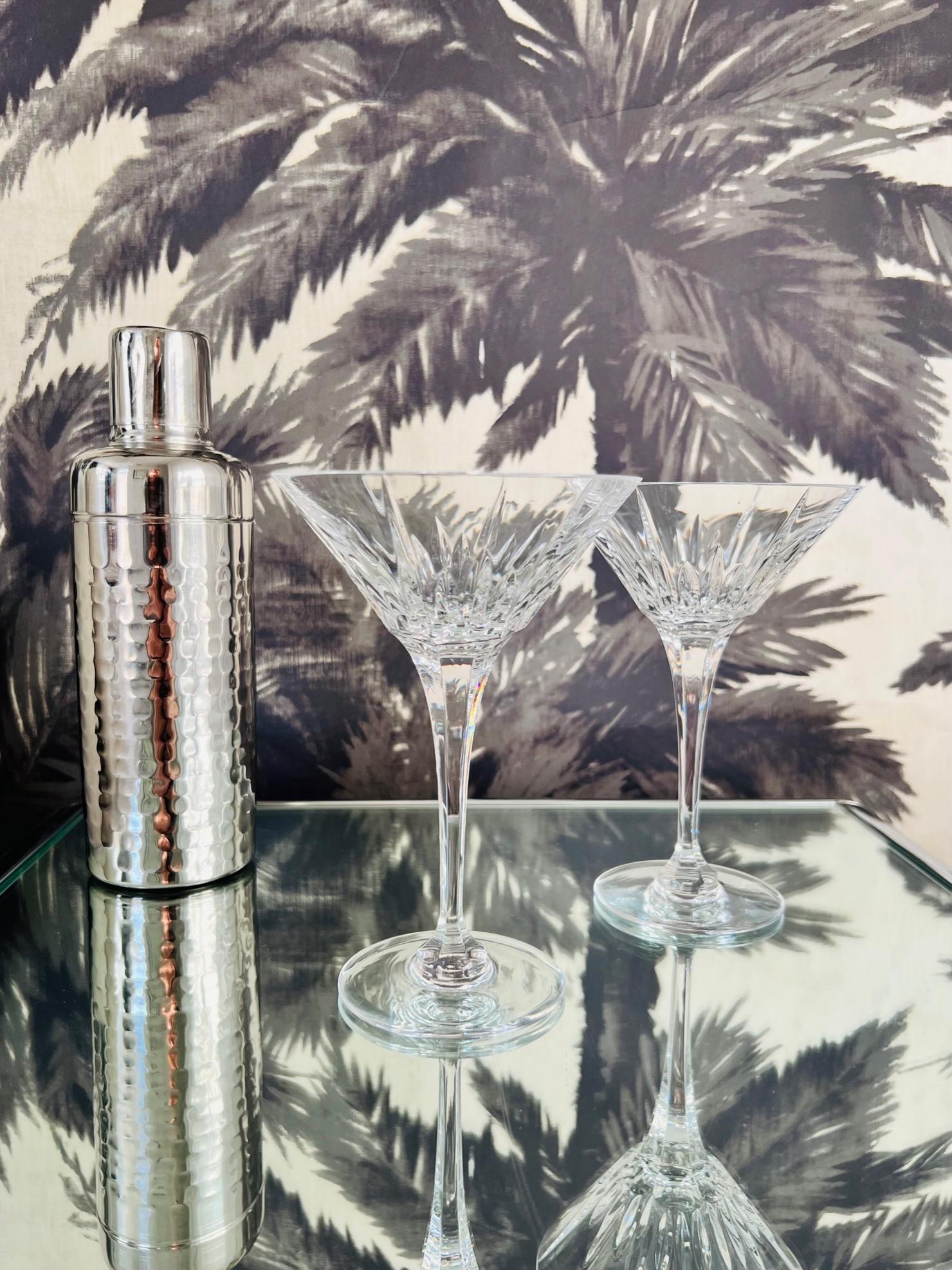 Pair of luxury crystal martini or margarita glasses from Waterford Crystal. The Lismore Collection is perhaps Waterford's most distinguished design featuring hand blown crystal with the pattern's signature diamond and wedge cuts. First introduced in