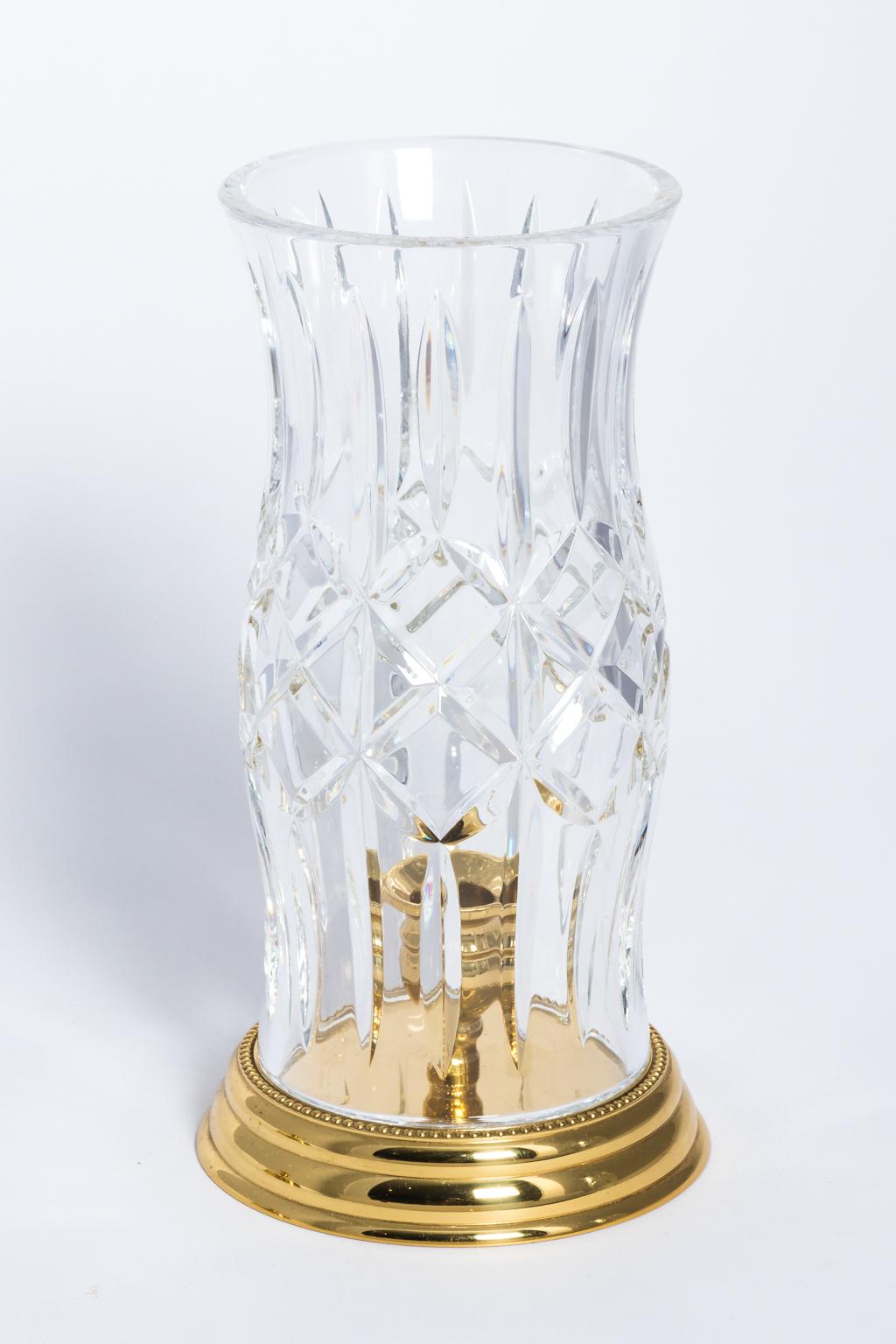 Waterford Irish cut cylinder hurricane lamps. Signed on cylinder also under brass base. Hold candles.
  