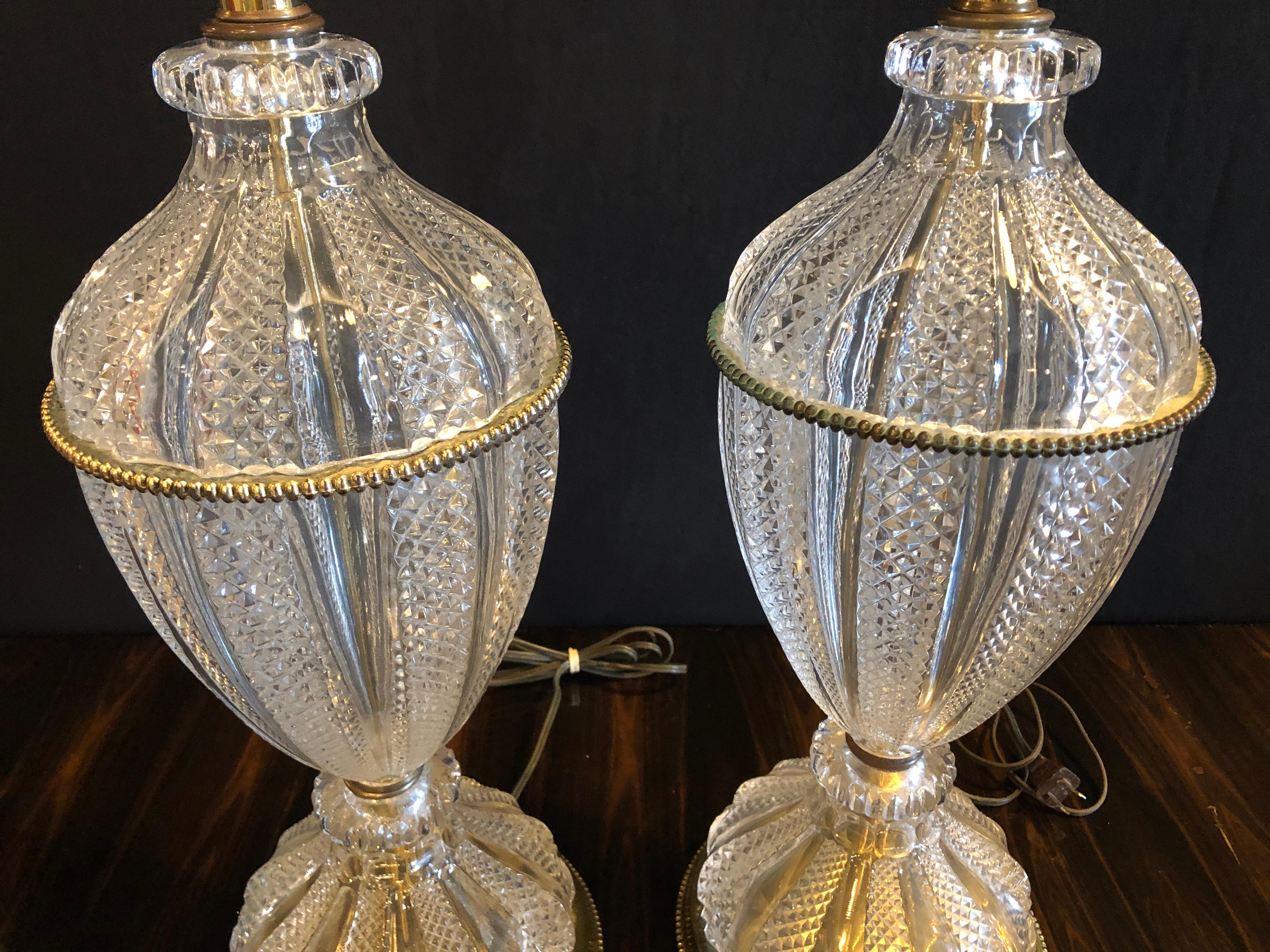 Pair of stunning Waterford style crystal lead urn form finely cut table lamps with bronze or brass mounts.