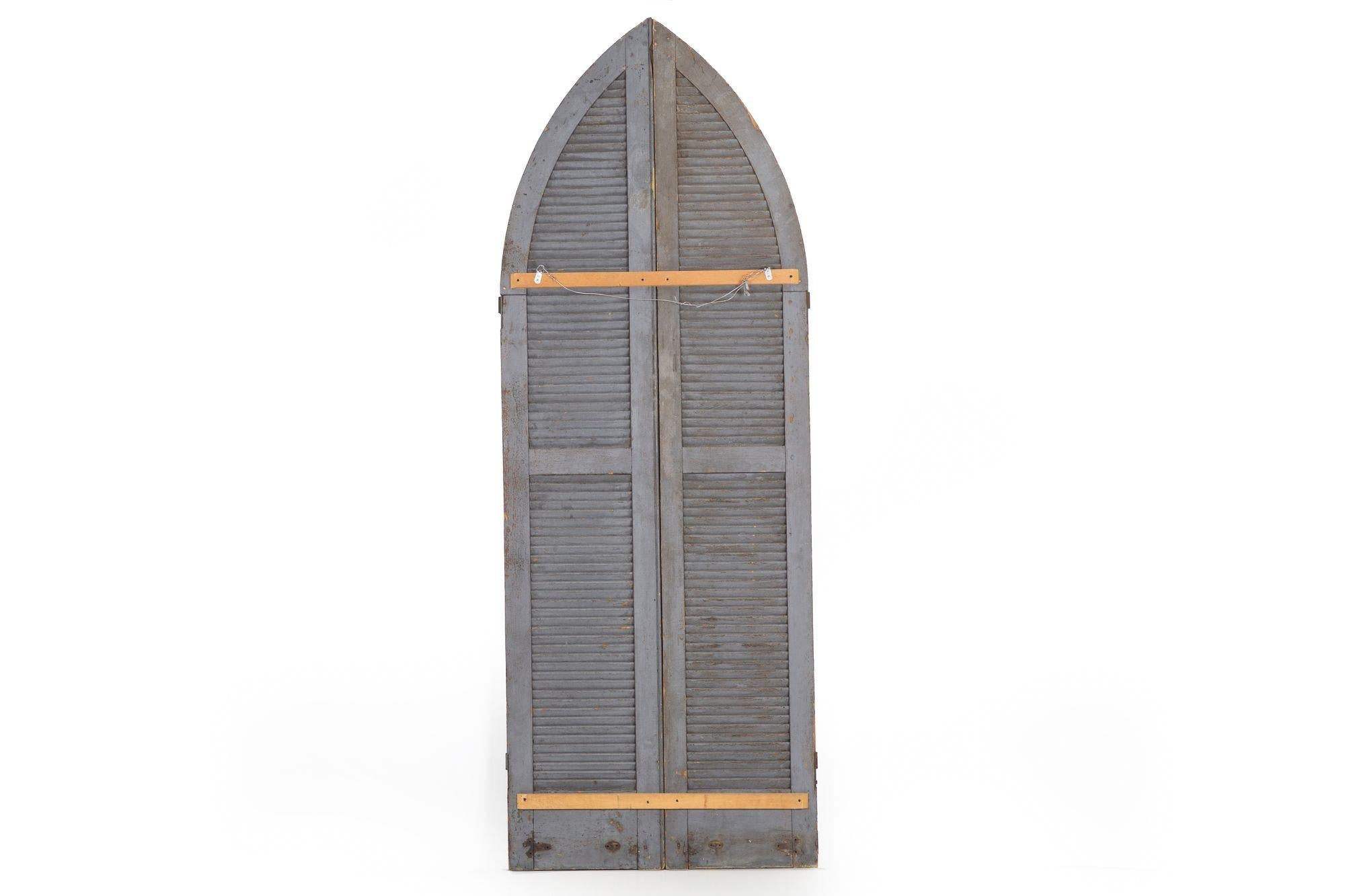 PAIR OF WEATHERED GRAY-PAINTED ARCHED DOME LOUVERED DOORS
American, circa 19th century
Item # 203MEK04P 

A vibrant pair of arched and louvered doors with wonderful early craftsmanship utilizing tenon-mortised joints secured with tiny wooden pins,