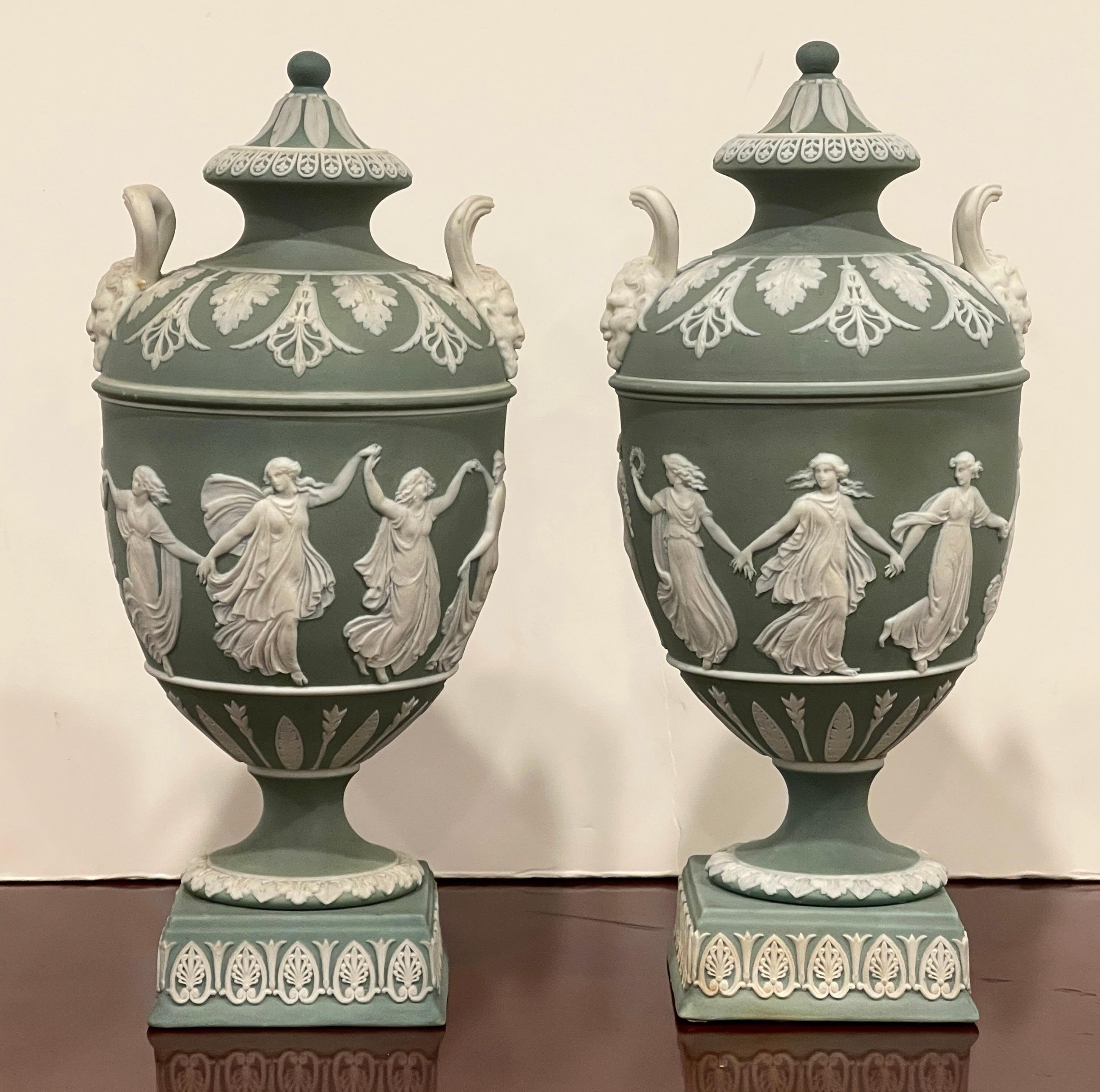 Pair of Wedgwood Olive Basalt ‘Dancing Hours ‘ Vases with Covers
England, Circa 1900s
Stamped 'WEDGWOOD/ Made in England'

A rare pair of Wedgwood olive green jasperware vases with covers, with the 'Dancing Hours' designed by the English