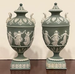 Pair of Wedgwood Olive Basalt ‘Dancing Hours ‘ Vases with Covers