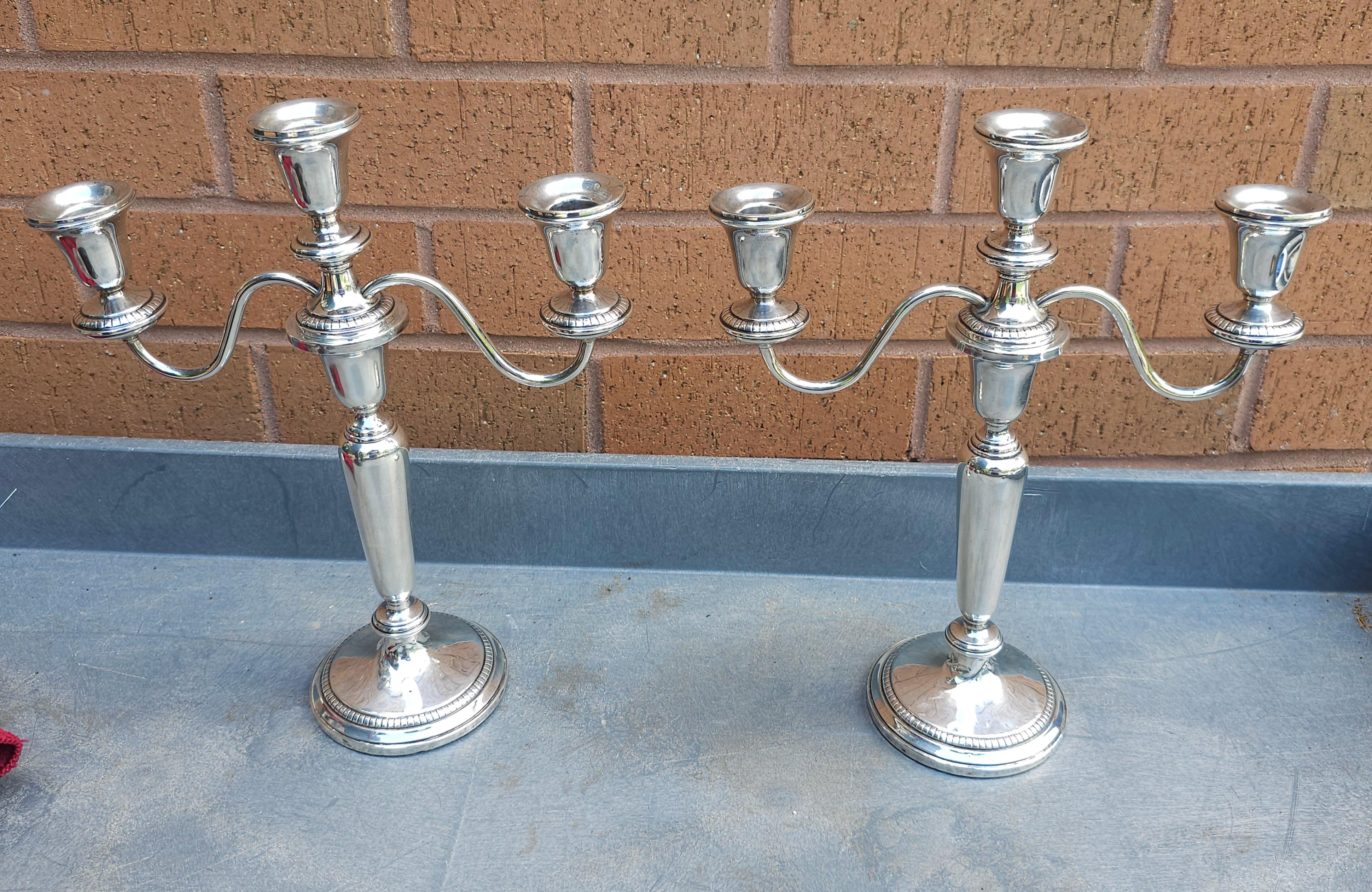 Pair of Weighted Sterling Silver Convertible Three-Light Cadelabra. Base is 4