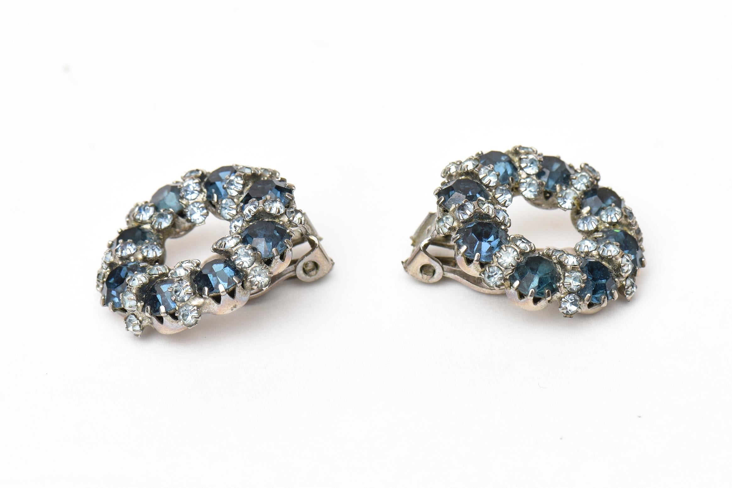 These classic and lovely signed Weiss clip on earrings are vintage from the 50's. The glass and rhinestones are beautiful shades of light and darker blue hues. Dress them up or down. Always to be well dressed and adorned. Even great with jeans. They