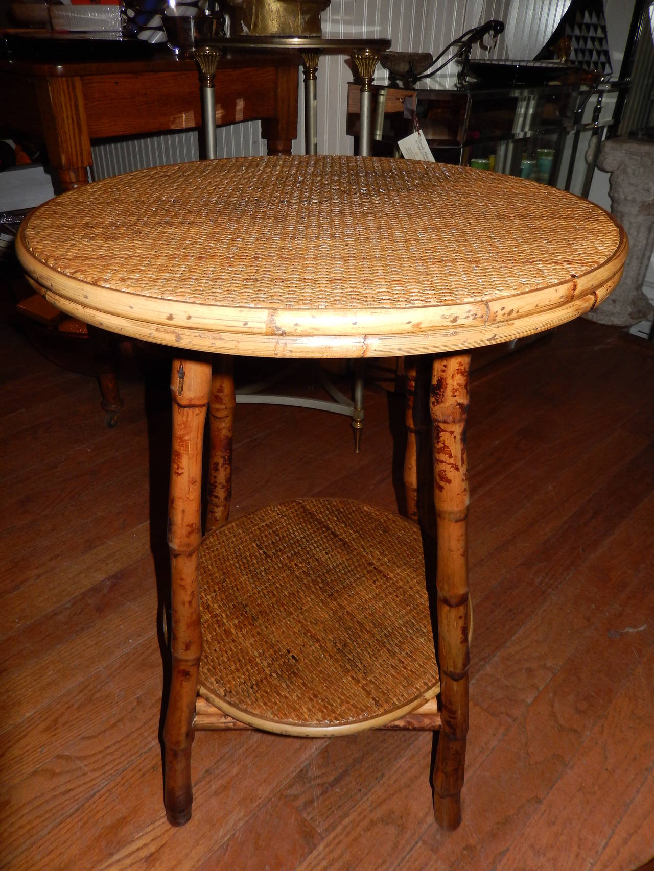 Pair of West Indies two level bamboo and handwoven cane side table in the Anglo Raj style.
  