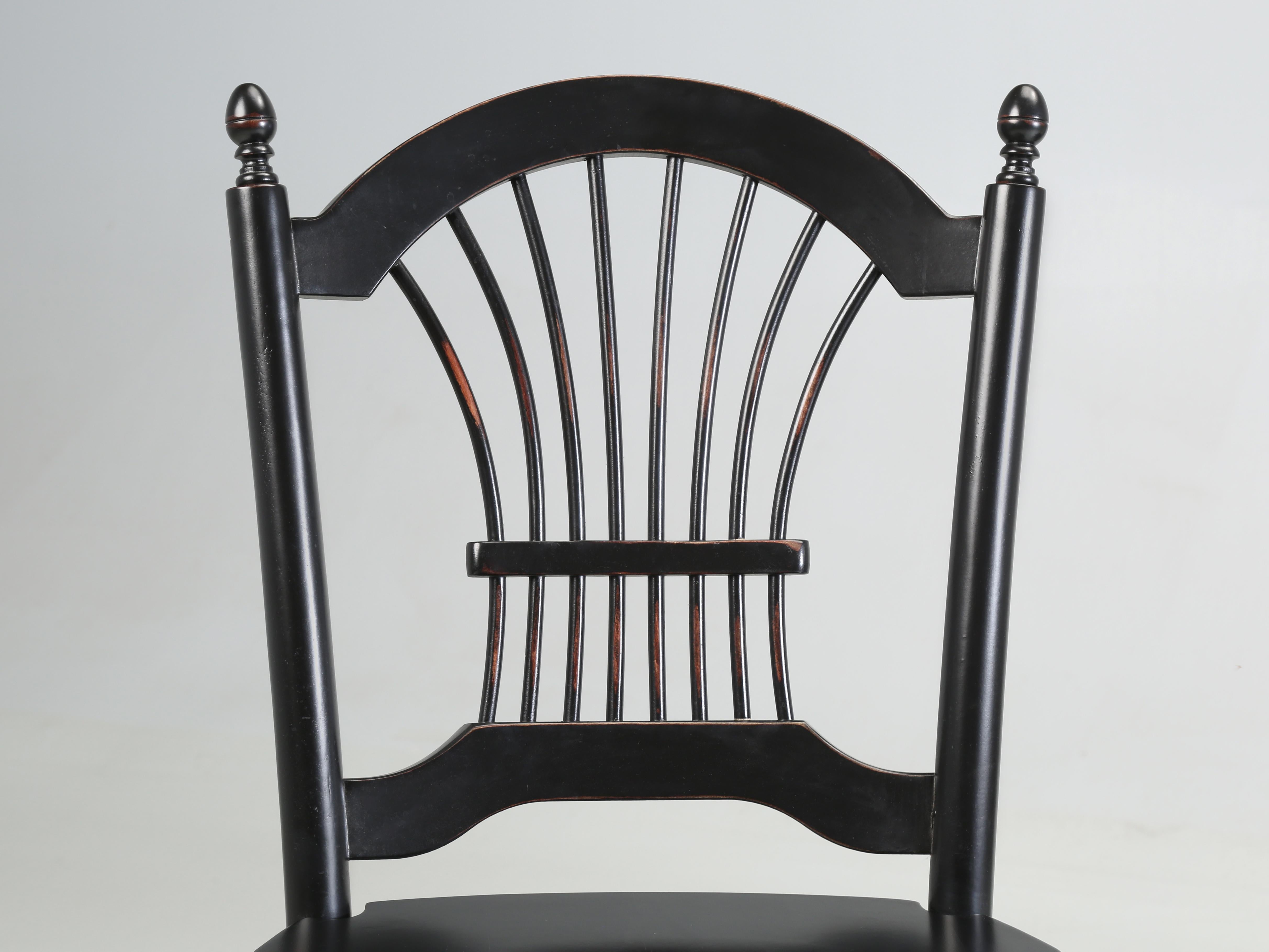 Pair of English Counter Stools in a Classic Wheatback Design in black lacquer. Imported from England over 25 years ago and remain in very nice original condition. 