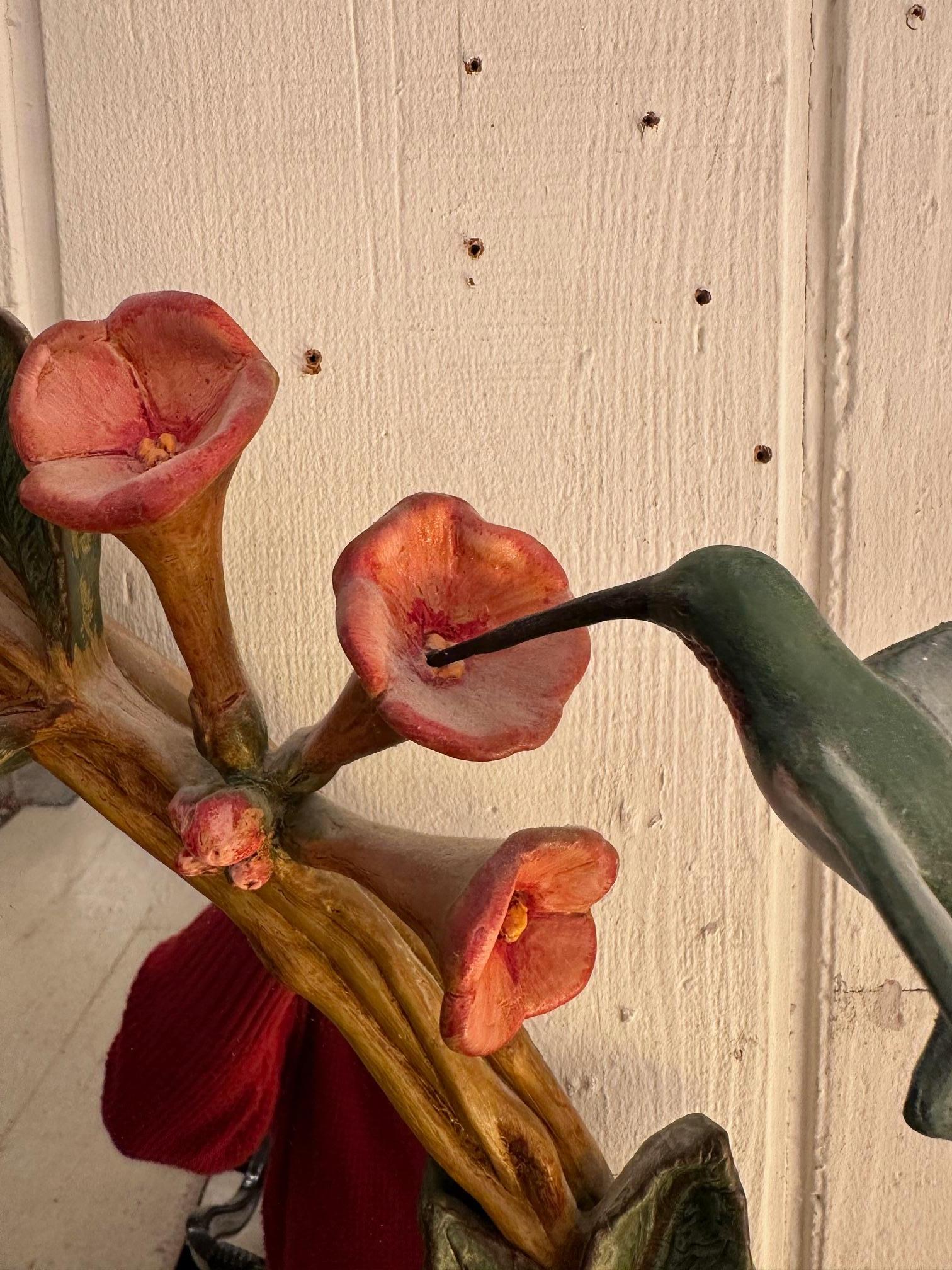 Carol Canner for Carvers Guild whimsical sculpted mirror having 
 trumpet flowers and vines with lovely humming bird that fit into small holes in one flower.
