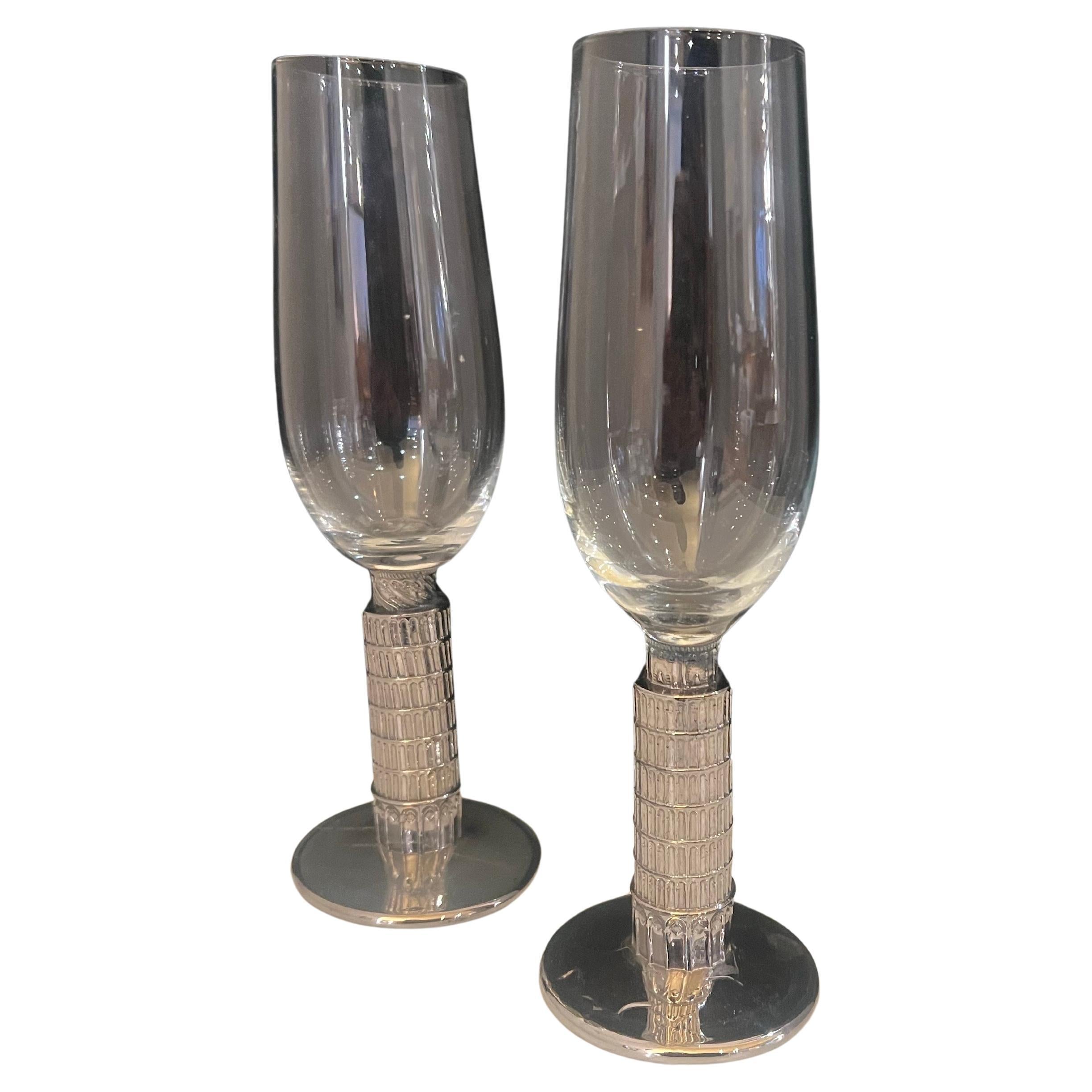 Pair of whimsical tower of Pisa tilted wine glasses with silver glass base, circa 1980's .