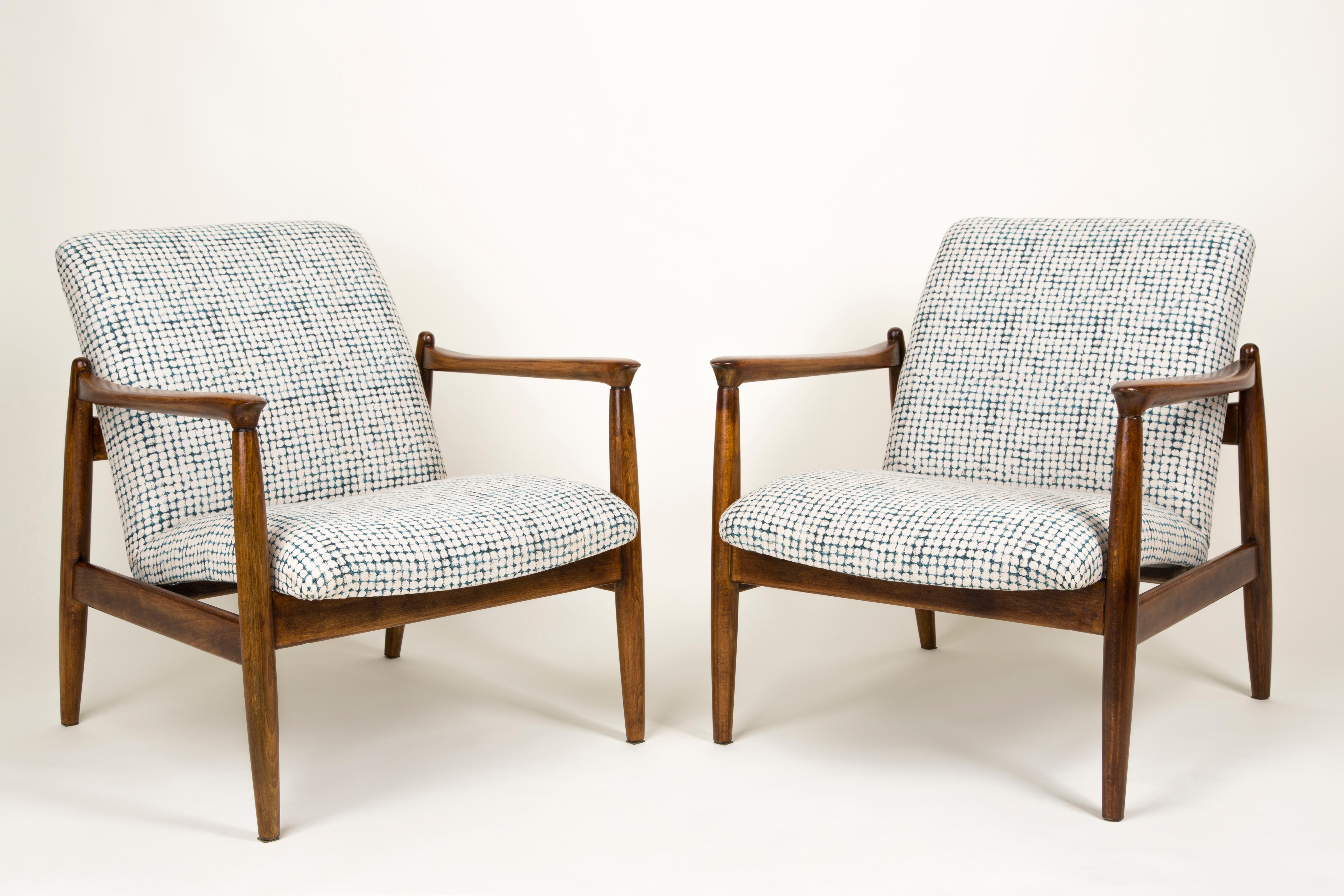 A pair of beautiful armchairs, designed by Edmund Homa. The armchairs were made in the 1960s in the Gosciecinska Furniture Factory. They are made from solid beechwood. The GFM type armchair is regarded one of the best polish armchair design from the