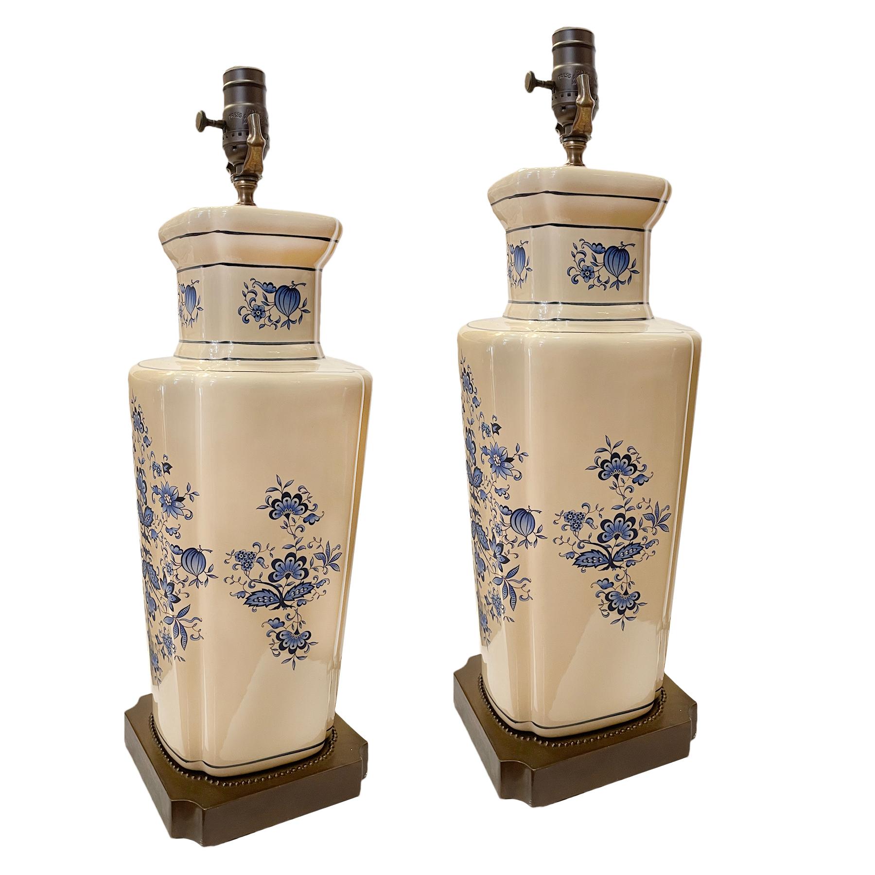 A pair of 1950's English cream porcelain lamps with floral decoration.

Measurements:
Height of body: 17.75