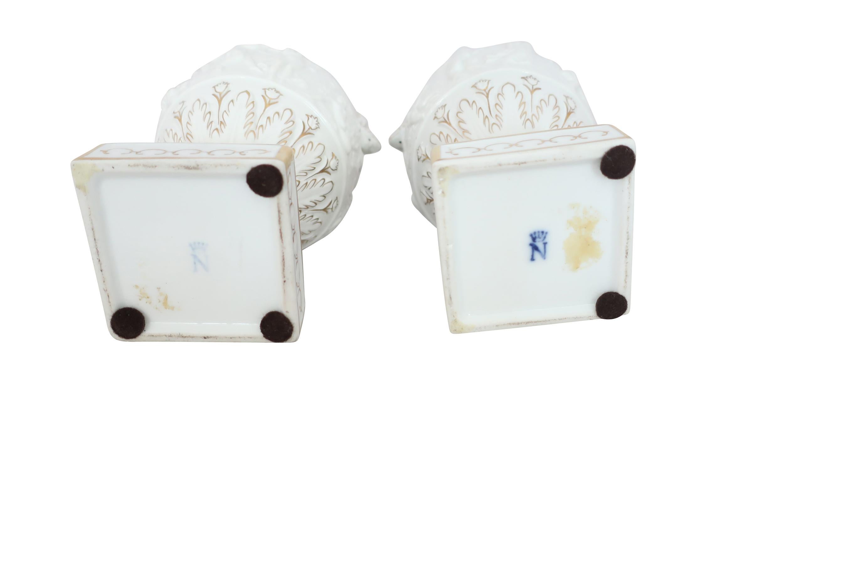 Italian White and Gilt Capodimonte Porcelain Urns with Lids and Putti Decoration