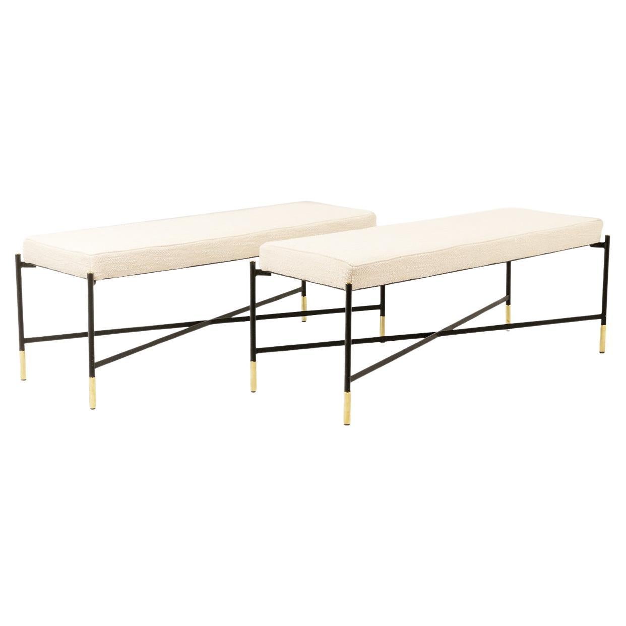 Pair of white benches, in lacquered and gold metal. 2000s.