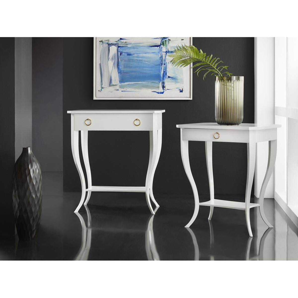 White Biedermeier Side Table, with a high gloss white lacquered finish. This delicate contemporary Neoclassic table has feminine curves with a single drawer with a brass ring pull, a flat top, and shelf stretcher.

Dimensions: 24.75