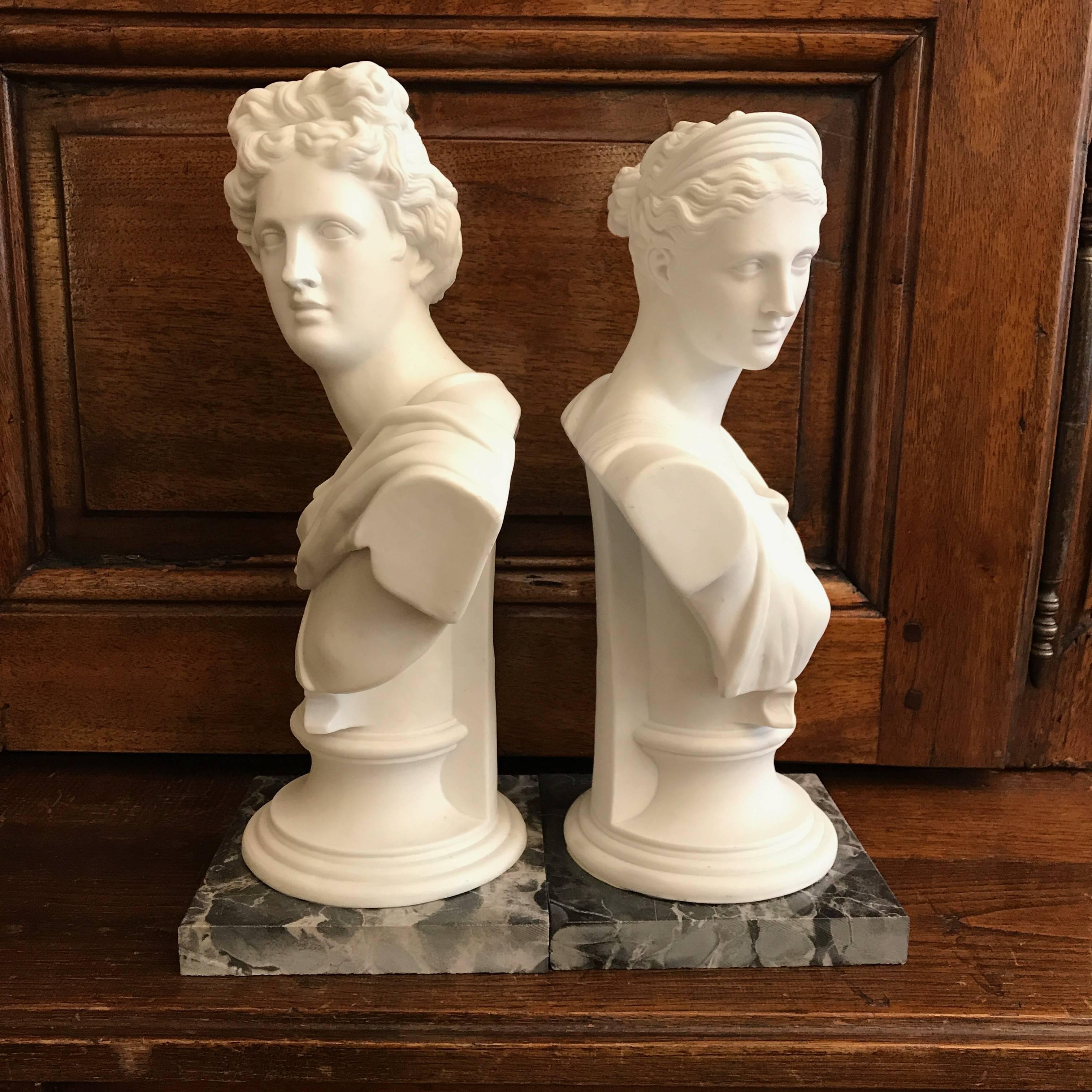 Belgian Black Marble Pair of White Biscuit Porcelain Busts of Apollo Belvedere and Diana from Italy