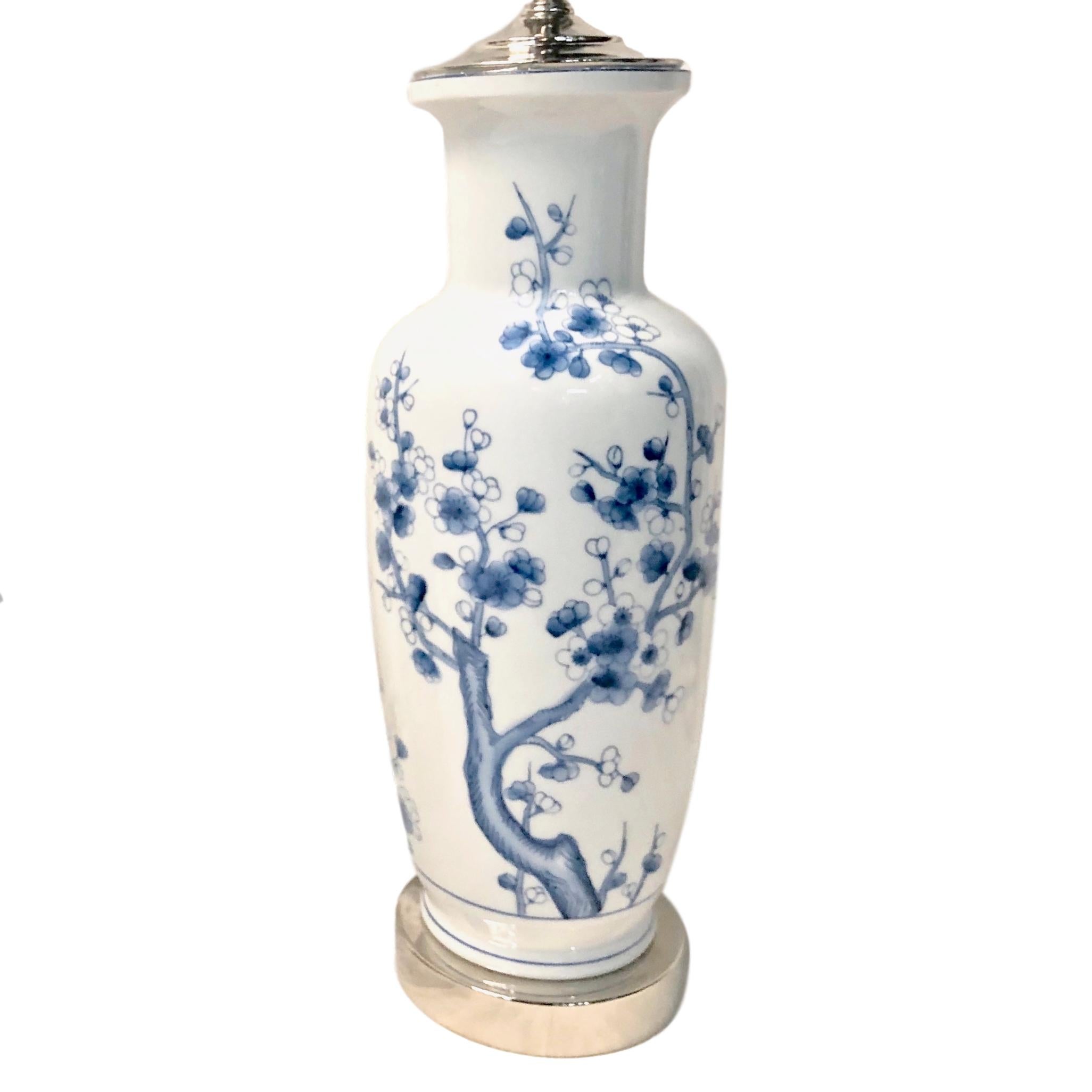 A pair of circa 1930's French white glazed porcelain with painted blue floral motif.

Measurements:
Height of body: 17