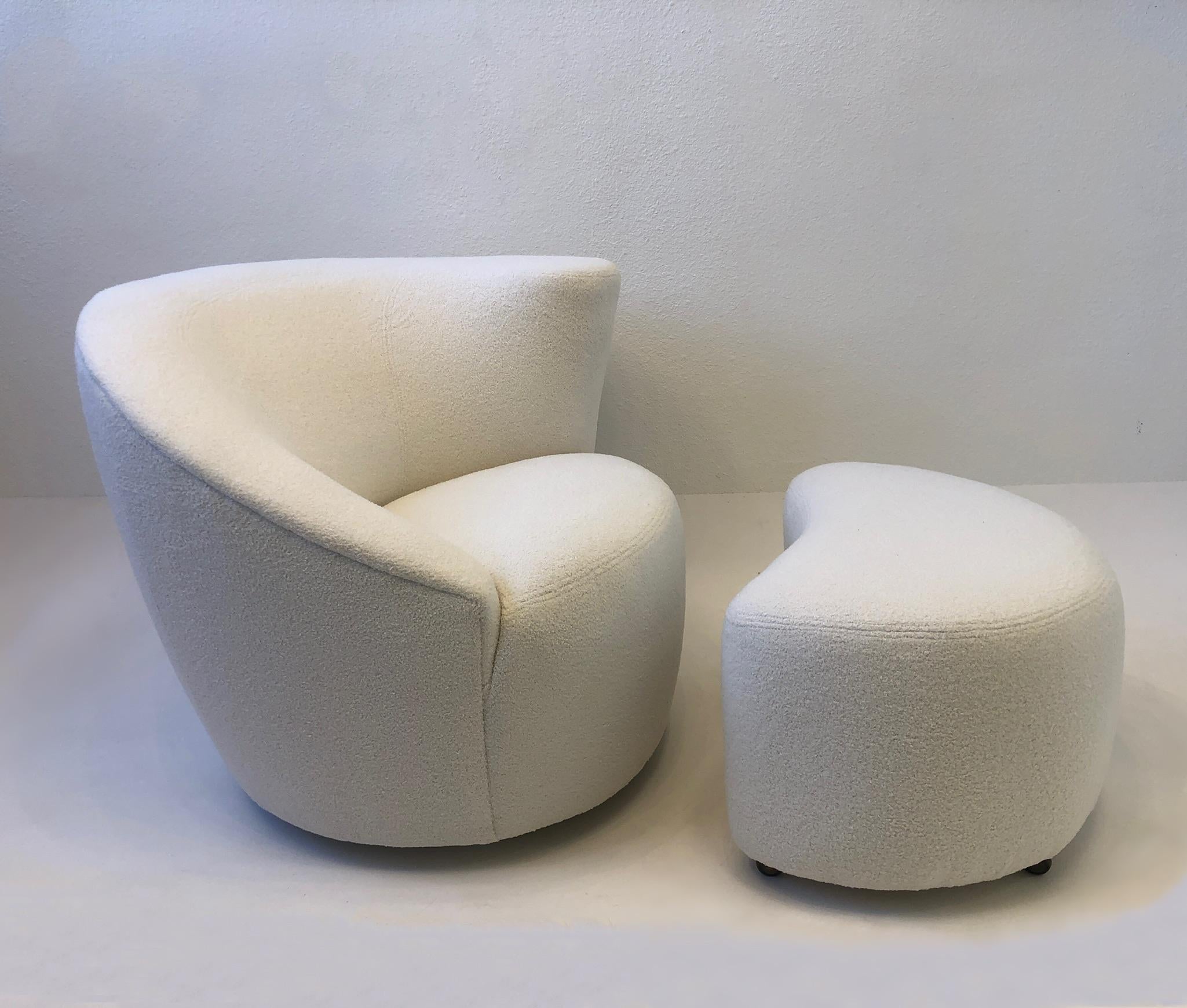 1990’s Pair of ‘Corkscrew’ lounge chairs and ottomans designed by Vladimir Kagan for Directional.
Newly recovered in a soft boucle fabric. The chairs rotate 180 and return to original position, the ottoman have aged brass casters. 
Measurements: