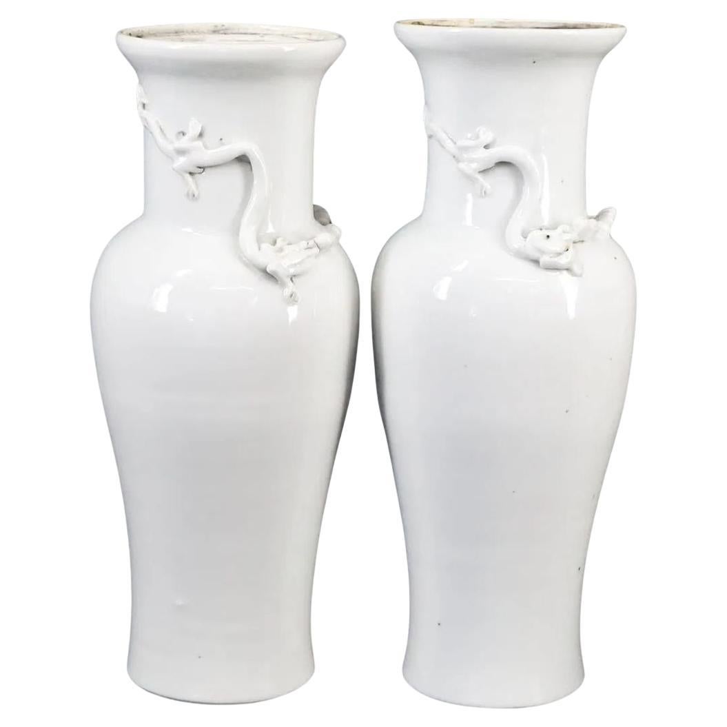 Pair of White Chinoiserie Vases With Dragon Motif