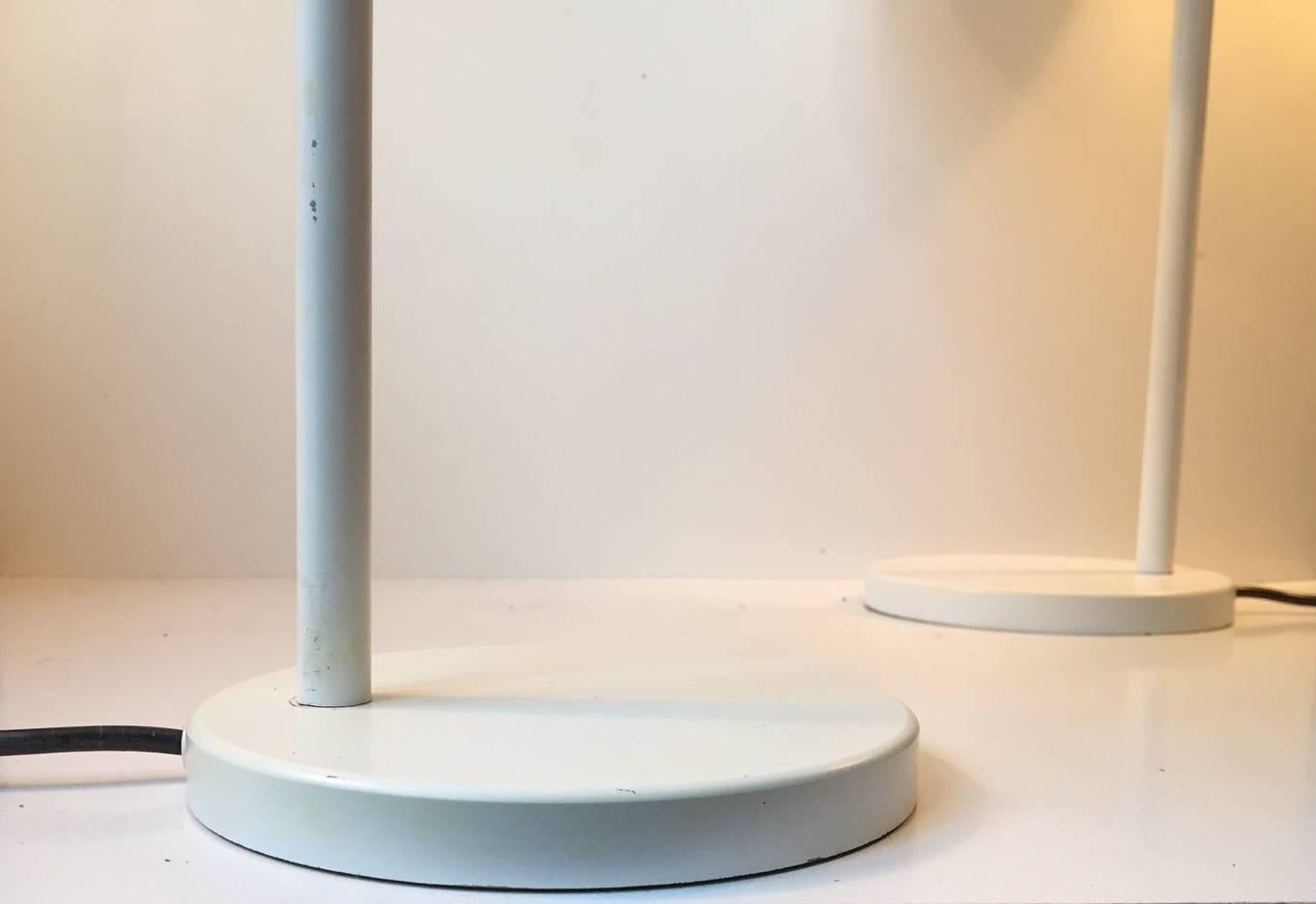 A pair of rare 'Combi' table or desk lamps designed by Danish architect Per Iversen in 1967. Manufactured by Louis Poulsen in Denmark during the 1960s-early 1980s. Very similar in construction to Hans Jorgen Wegner's Opala series with its