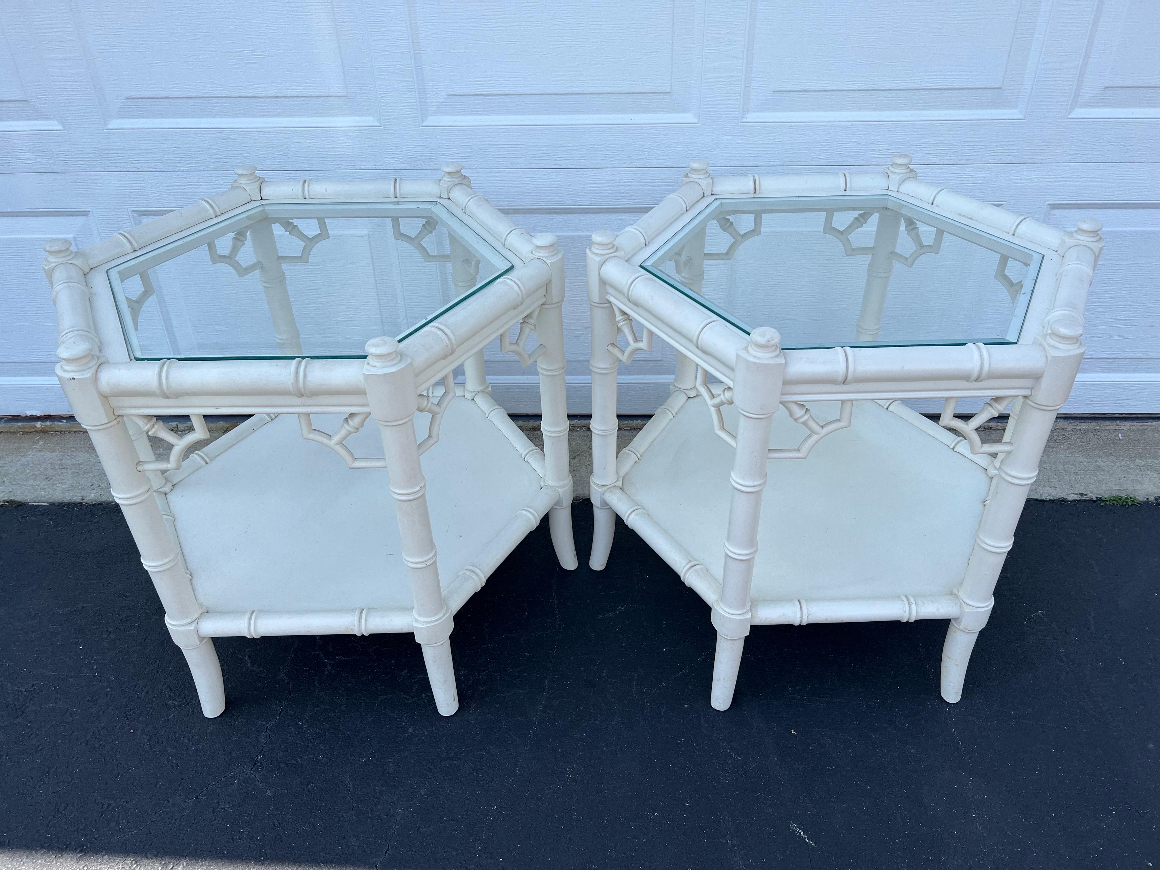 Pair of White Faux Bamboo Octagonal Tables by Thomasville. Amazing Two -tiered Chinoiserie style end tables with detailed fretwork at every angle. Glass tops are removeable. One glass top has a bevel and one doesn't a bevel. There is 14