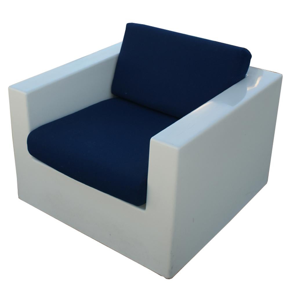 A pair of mid century modern lounge chairs made of white fiberglass with navy blue cushions.  There is a slight difference in the shades of white.  As shown in the last image, we have other similar fiberglass pieces listed on 1stdibs.