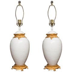 Pair of White Glazed Ceramic Lamps with Gilt Bronze Mounts