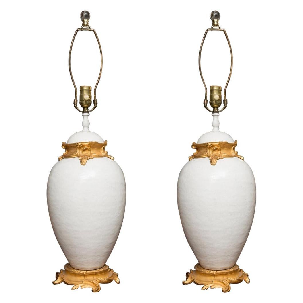 Pair of White Glazed Ceramic Lamps with Gilt Bronze Mounts
