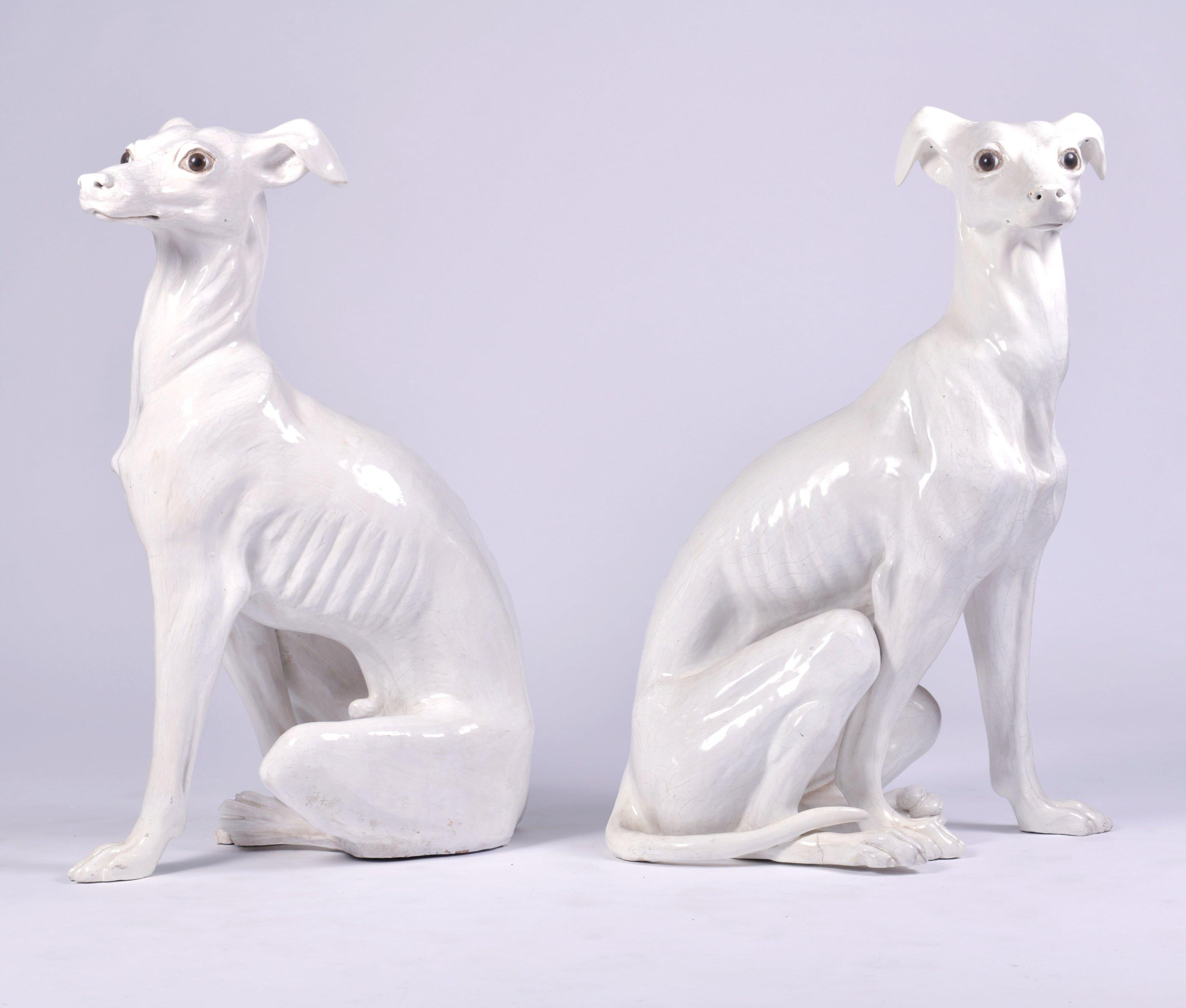This wonderful and very whimsical pair of terracotta greyhounds were from the French manufacturers Bavent and are finished with a white glaze. Each dog measures 16 in – 41.1 cm wide, 23 ¼ in – 59 cm deep and and 35 in – 89 cm in height. They would