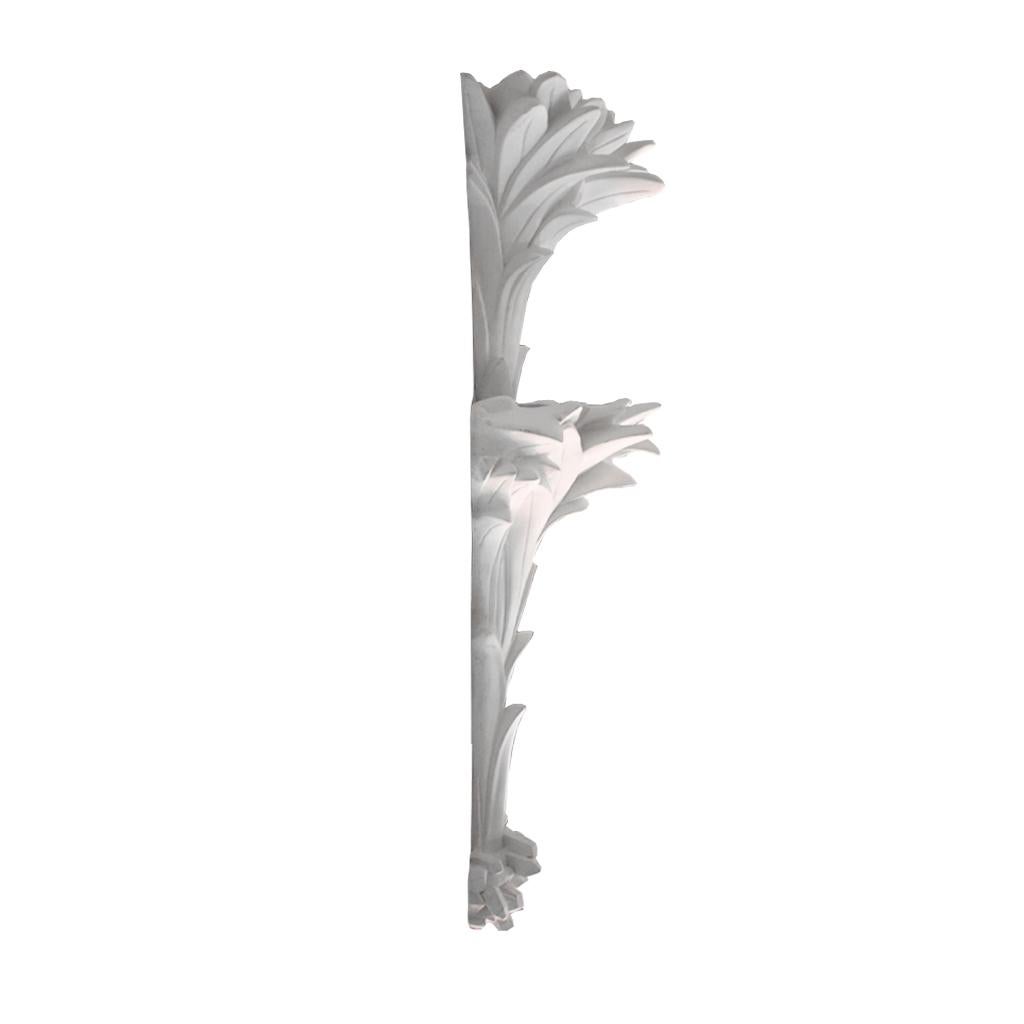 These impressive hand-carved white plaster sconces embody the iconic style reminiscent of Dorothy Draper. With their intricate plant motifs, these sconces showcase a seamless fusion of nature and design.

The white plaster construction lends a