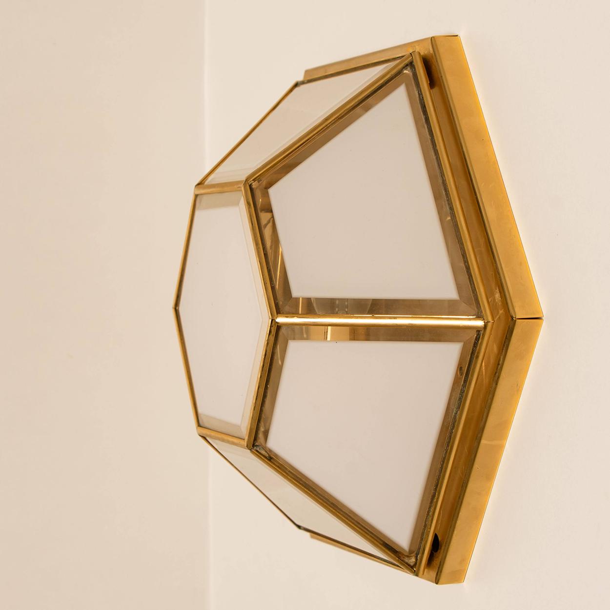 This beautiful and unique octagonal pair of glass light flush mounts or wall lights were manufactured by Glashütte Limburg in Germany during the 1970s, (early 1970s). Nice craftsmanship. Minimal, geometric and simply shaped design. White glass with
